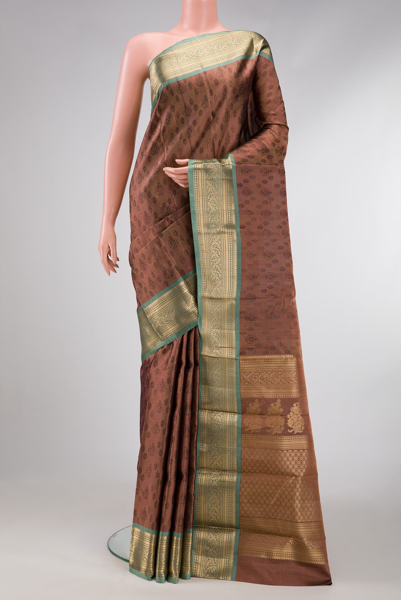 Brown Dual Tone Kanchipuram Tissue Silk Saree with Zari Brocade on the body and Zari Border.  displayed on a mannequin