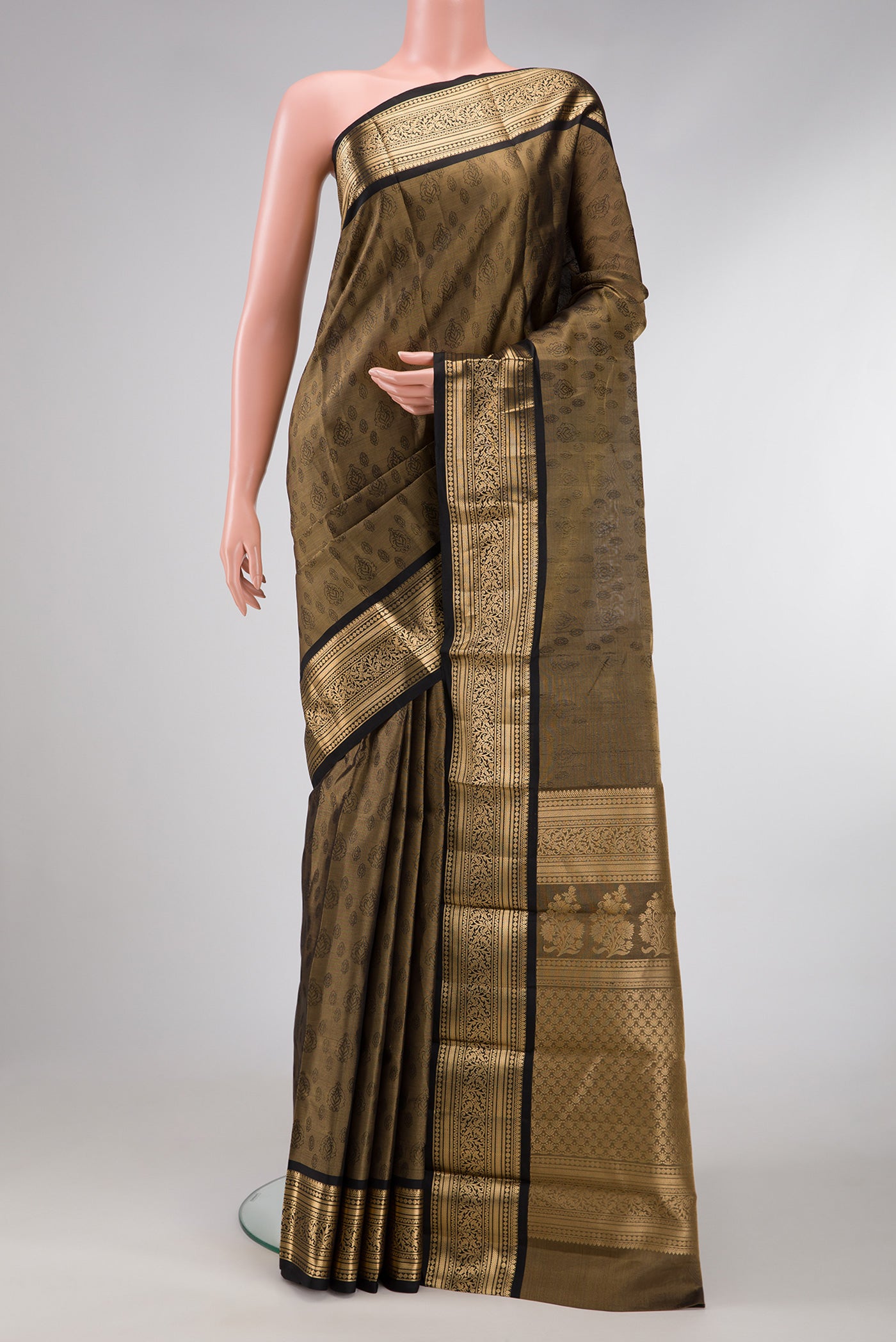 Gold Dual Tone Kanchipuram Tissue Silk Saree with Zari Brocade on the body and Zari Border.  displayed on a mannequin