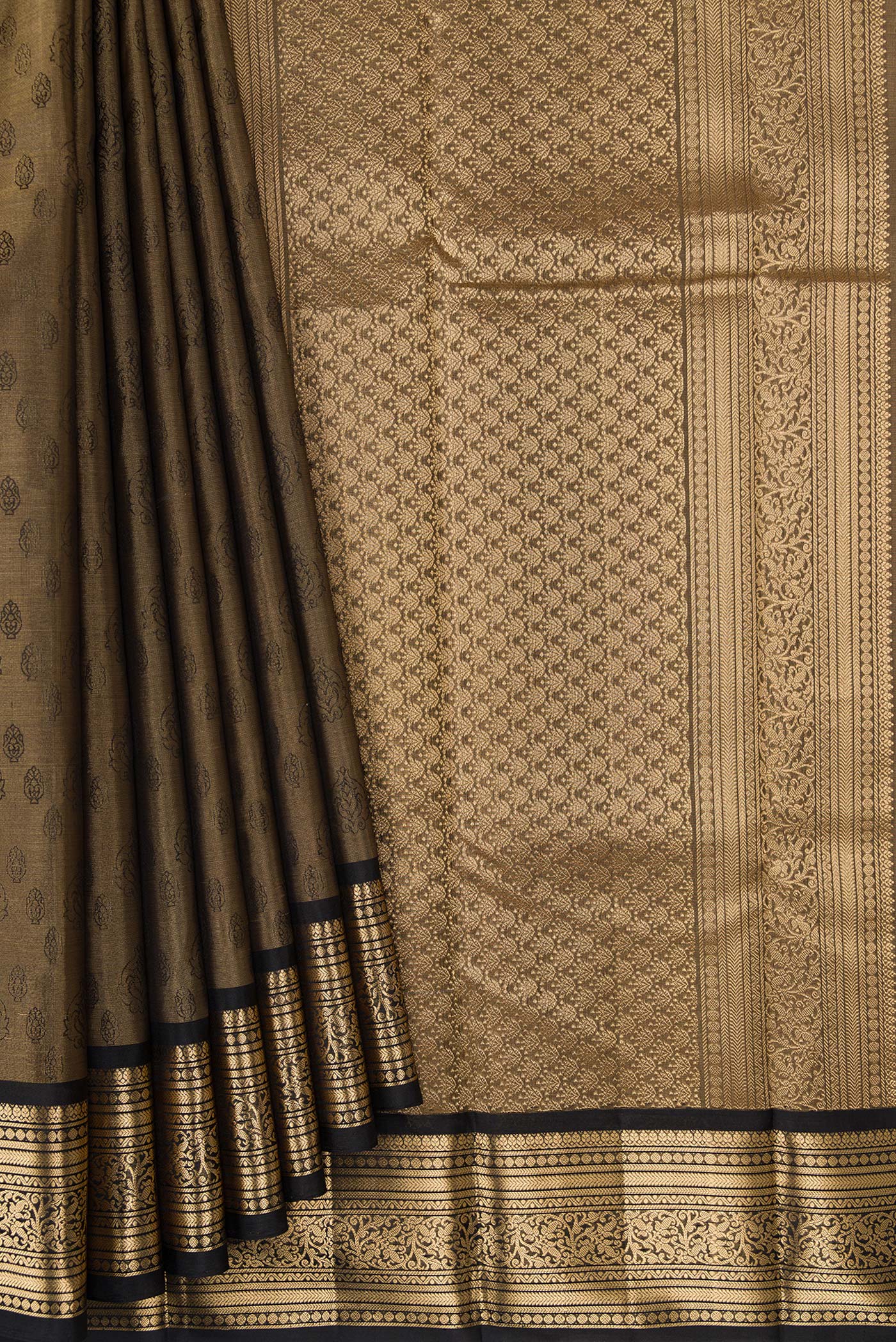 Pleats and pallu of Gold Dual Tone Kanchipuram Tissue Silk Saree with Zari Brocade on the body and Zari Border. 
