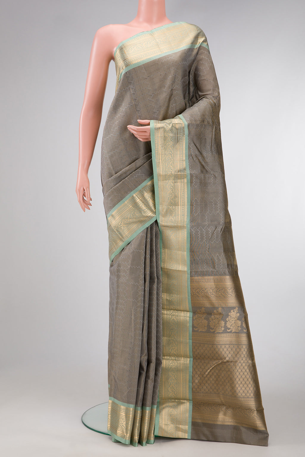 Grey Dual Tone Kanchipuram Tissue Silk Saree with Zari Brocade on the body and Zari Border.  displayed on a mannequin