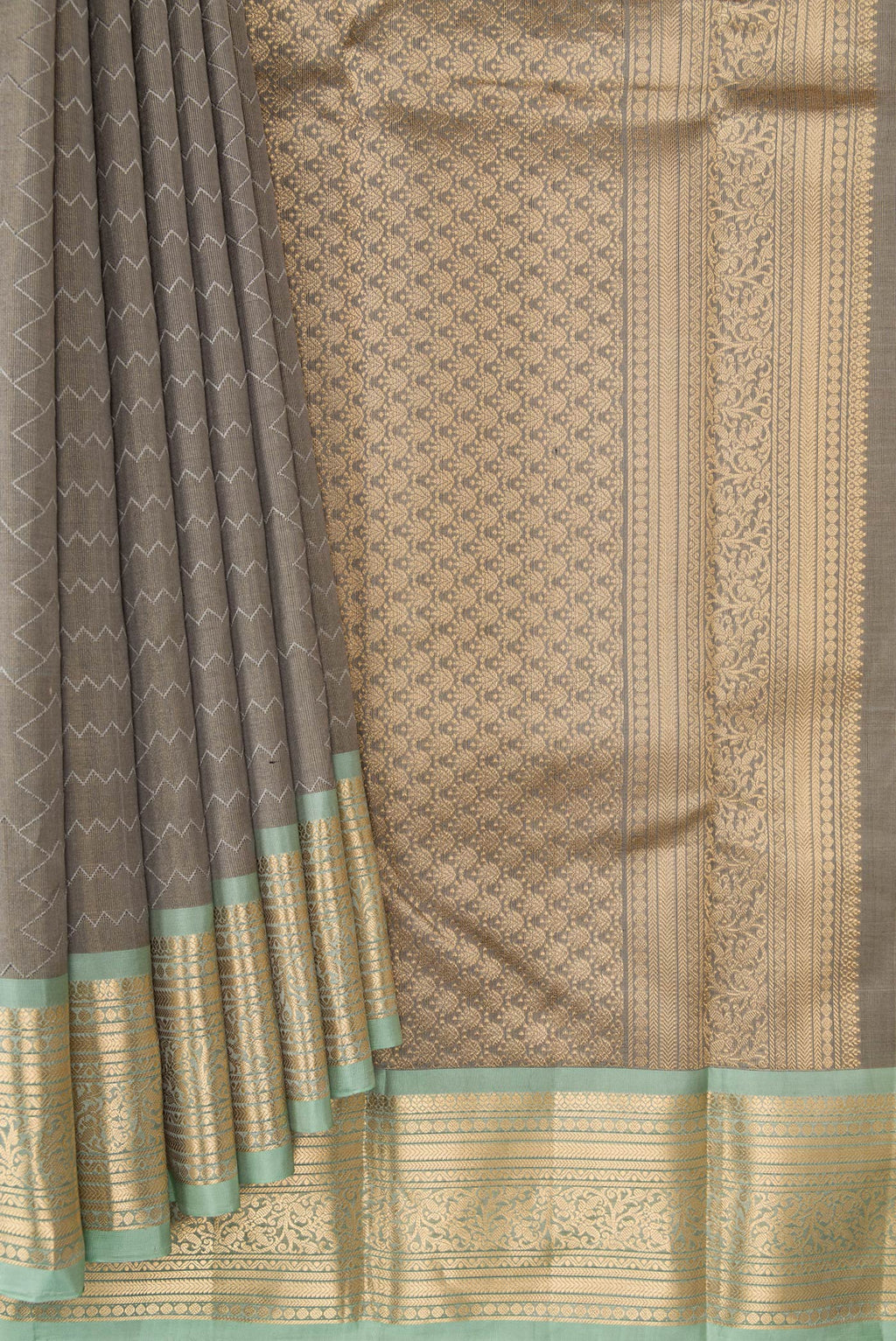 Pleats and pallu of Grey Dual Tone Kanchipuram Tissue Silk Saree with Zari Brocade on the body and Zari Border. 