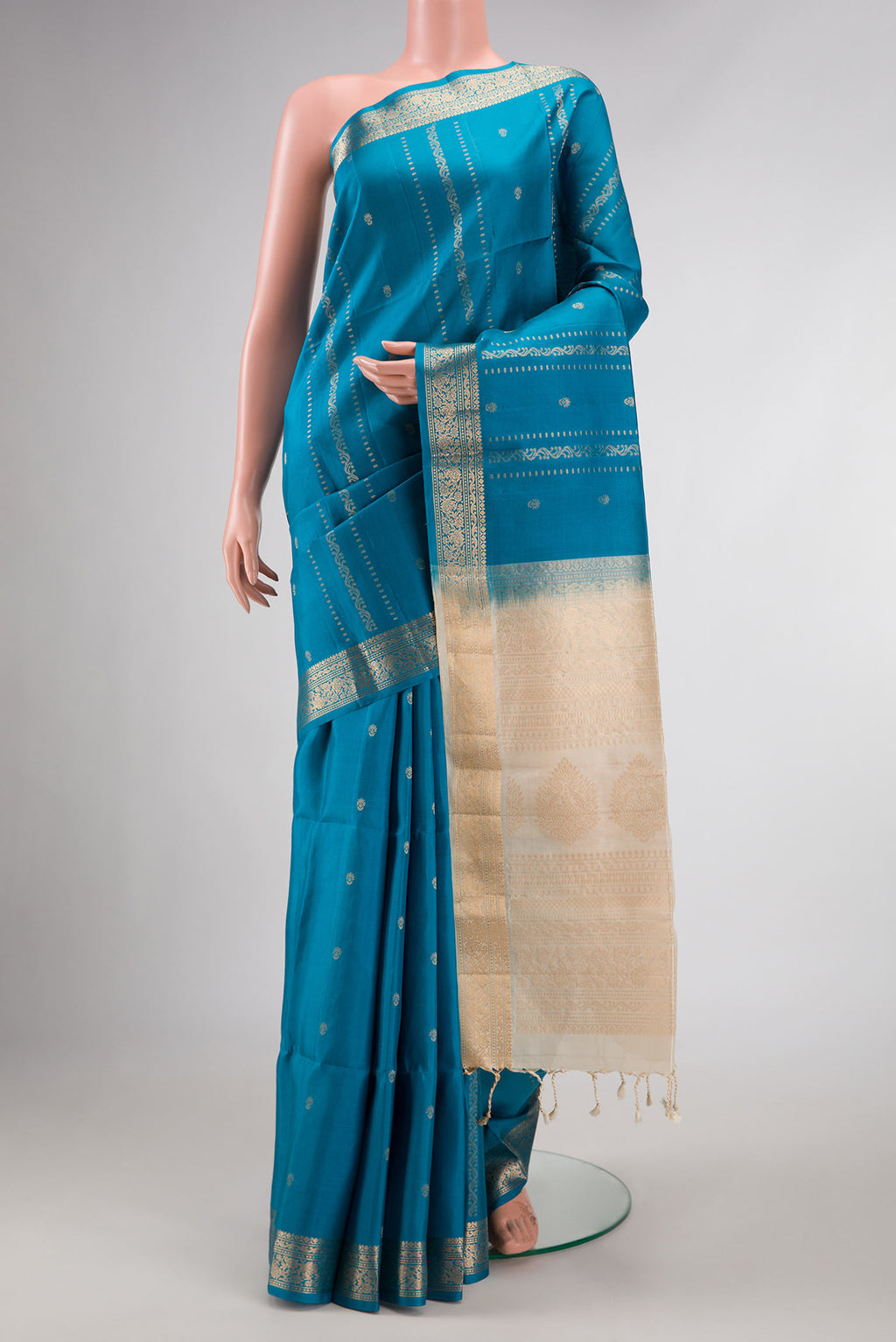 Blue Dual Tone Soft Silk Saree with Zari Butta on the body and Zari Border displayed on a mannequin