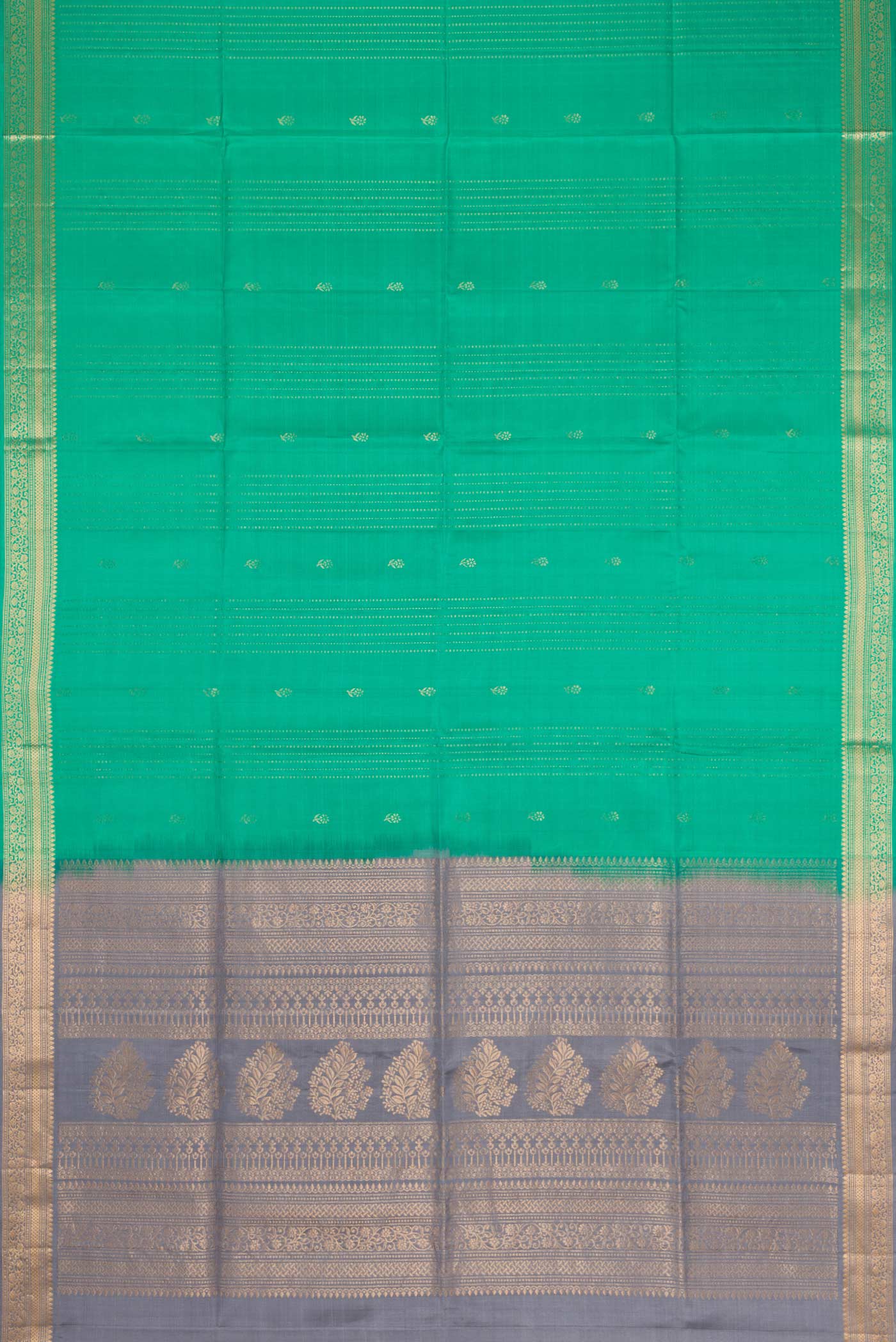 Flat view of Green Dual Tone Soft Silk Saree with Zari Butta on the body and Zari Border. 