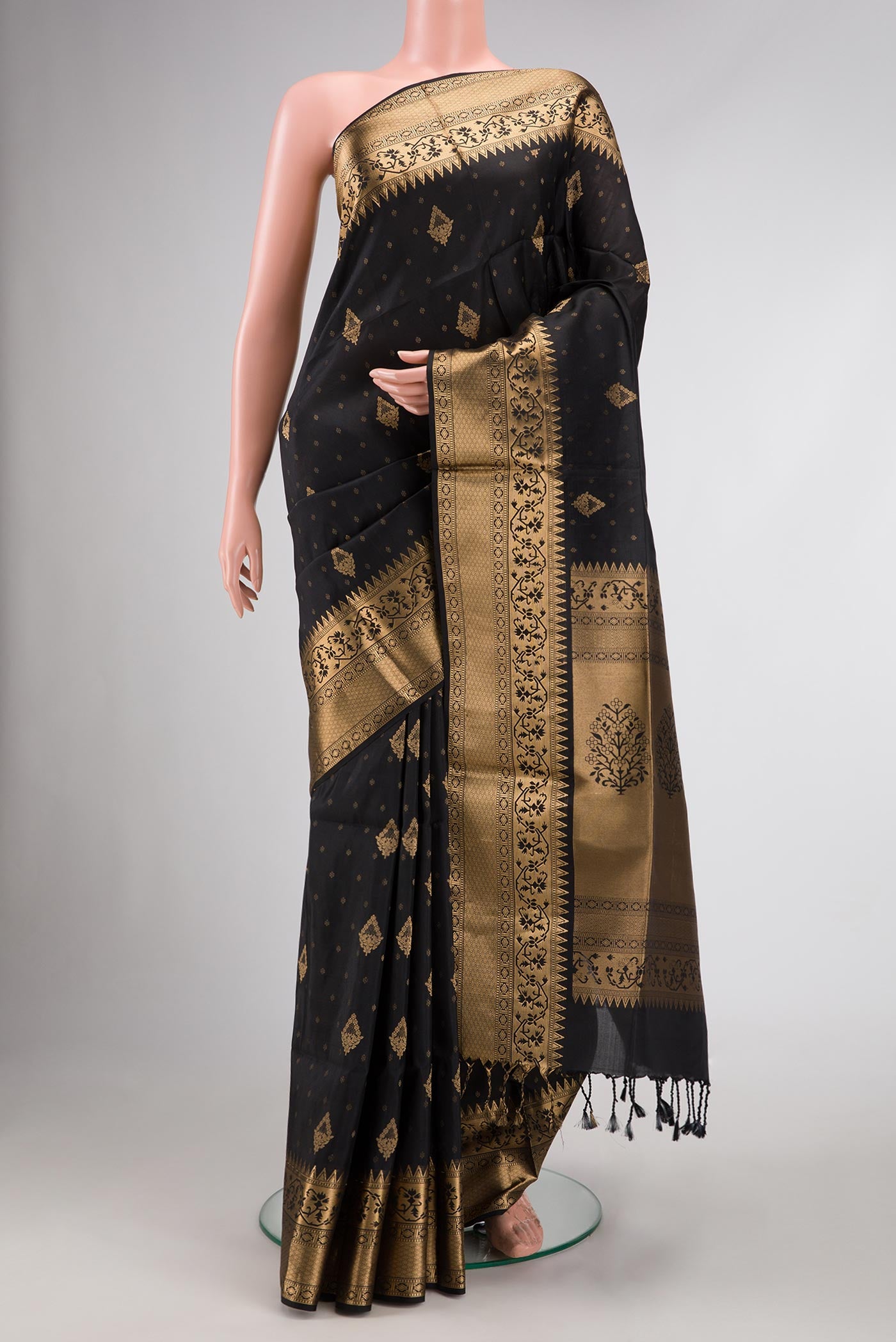 Black Dual Tone Soft Silk Saree with Zari Butta on the body and Zari Border.  displayed on a mannequin