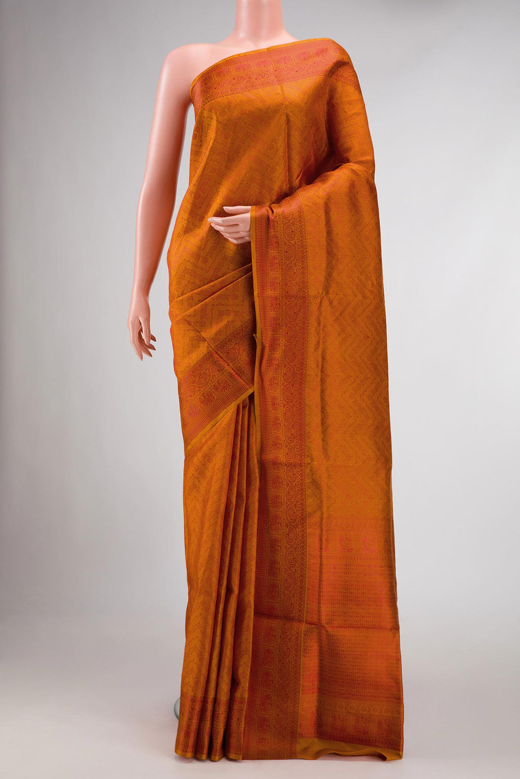 Orange Dual Tone Soft Silk Saree with Jacquard design on the body and Thread Border displayed on a mannequin