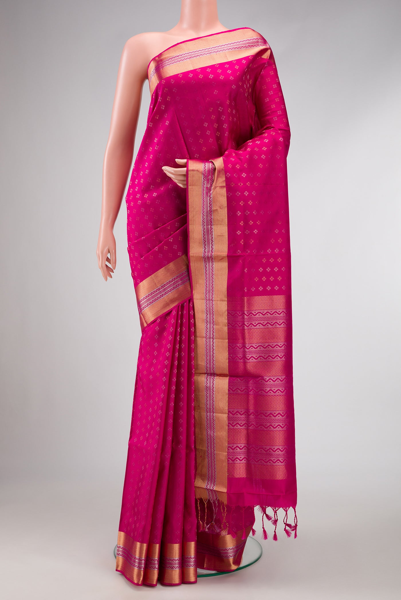 Dark Pink Dual Tone Soft Silk Saree with Zari Butta on the body and Zari Border.  displayed on a mannequin