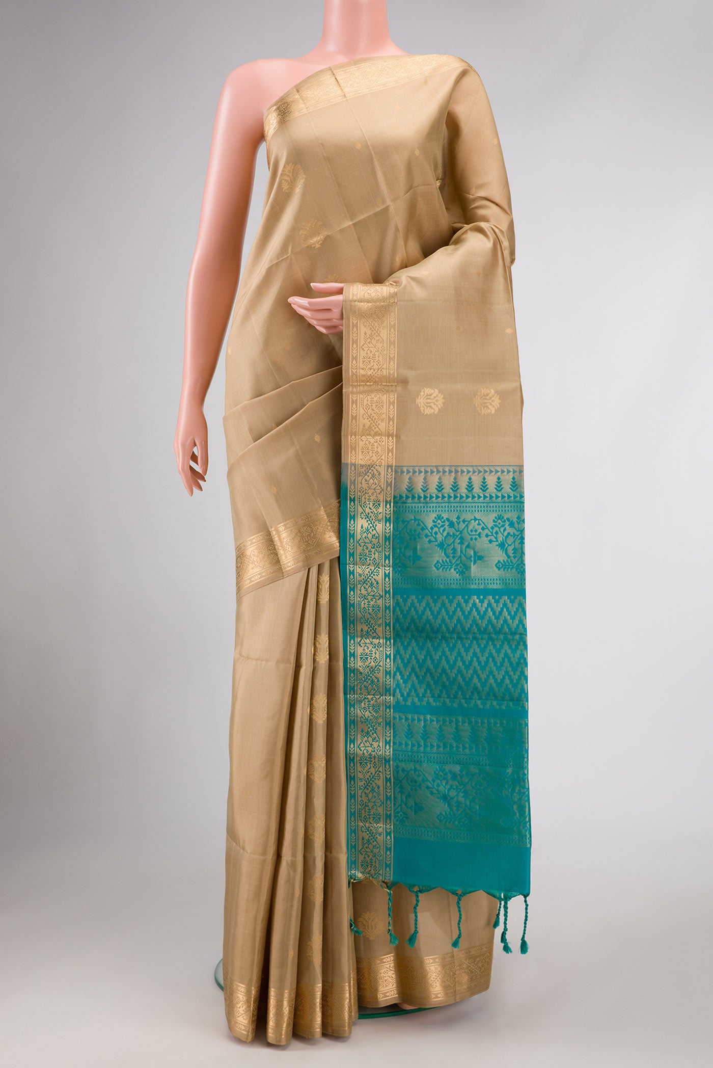 Dark Beige Dual Tone Soft Silk Saree with Zari Butta on the body and Zari Border.  displayed on a mannequin