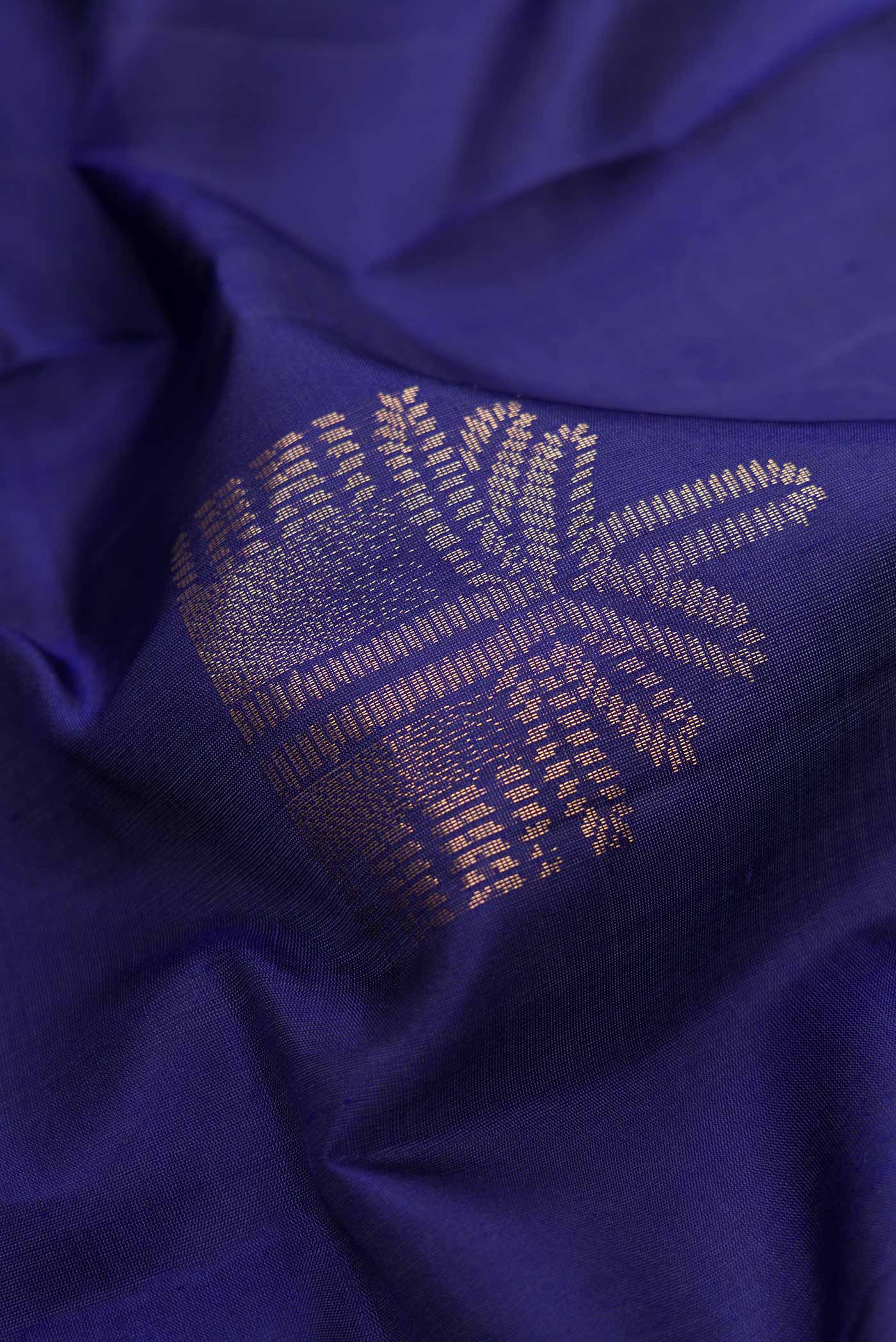 Close up of Navy Blue Dual Tone Soft Silk Saree with Zari Butta on the body and Without Border.  displaying folds