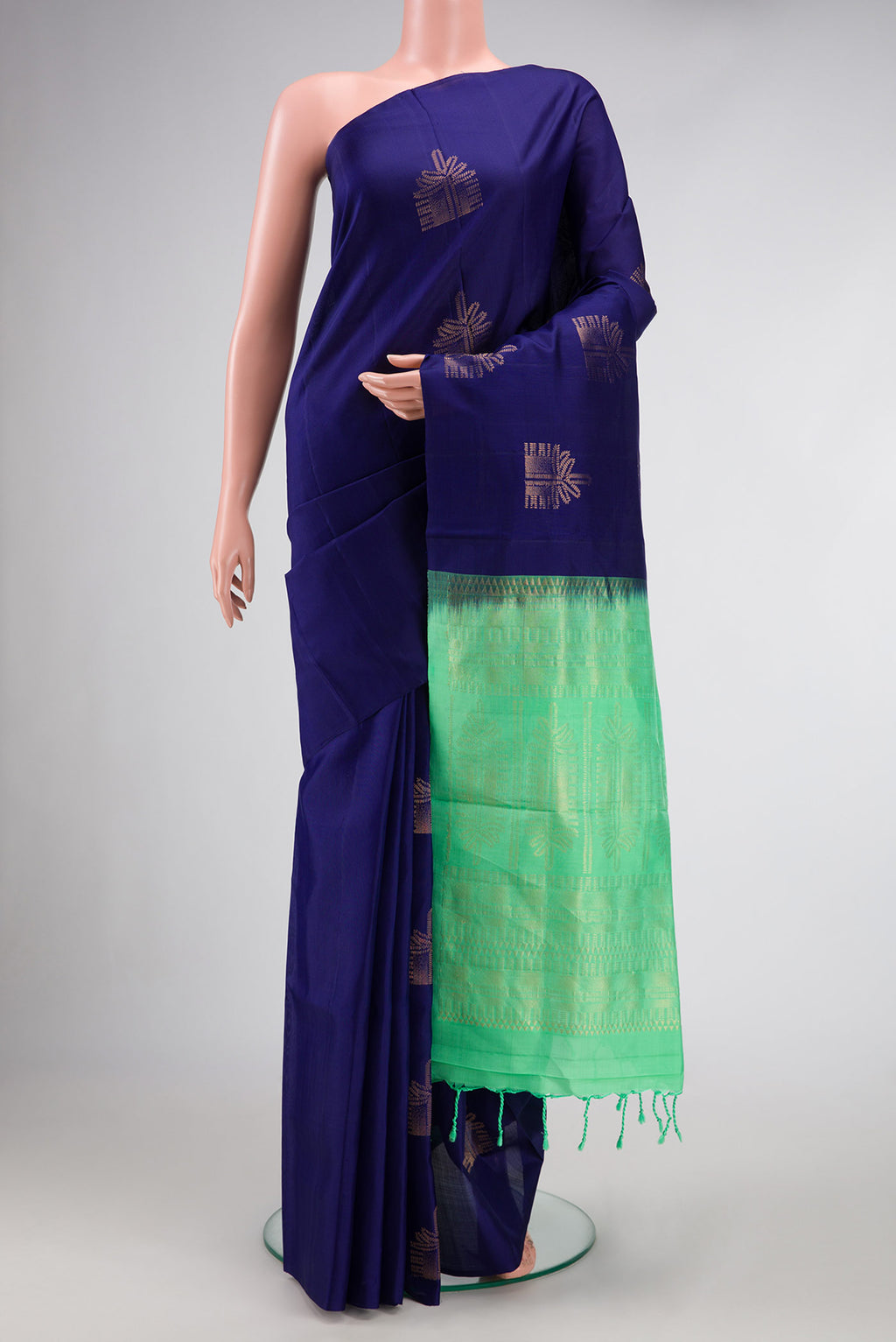 Navy Blue Dual Tone Soft Silk Saree with Zari Butta on the body and Without Border.  displayed on a mannequin