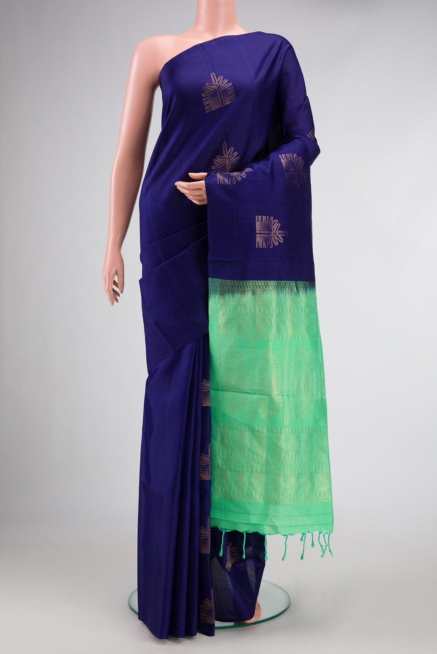 Navy Blue Dual Tone Soft Silk Saree with Zari Butta on the body and Without Border.  displayed on a mannequin