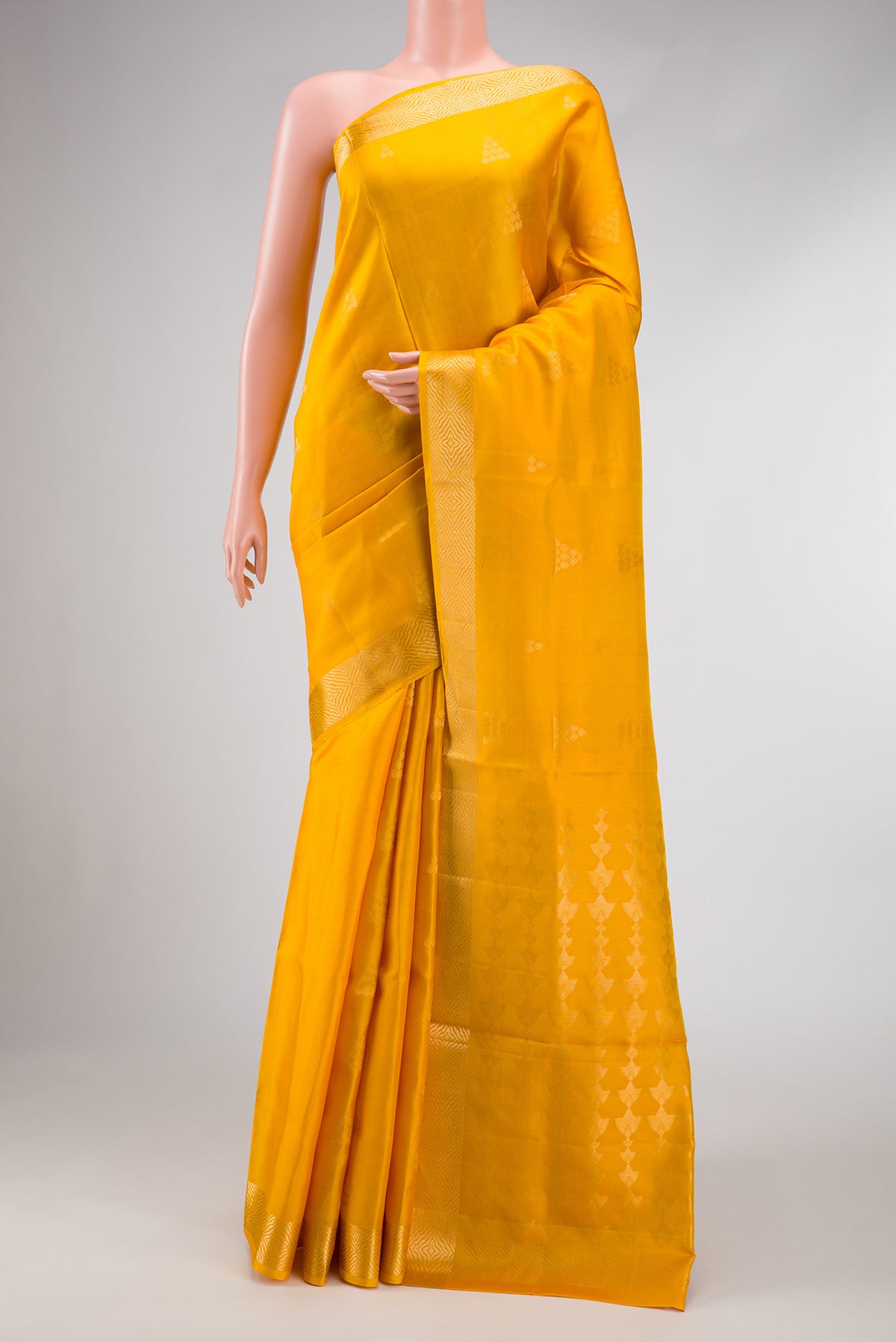 Yellow Dual Tone Soft Silk Saree with Zari Butta on the body and Zari Border.  displayed on a mannequin