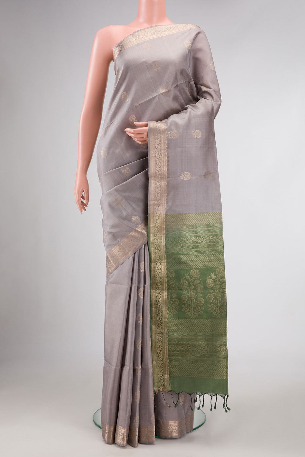 Grey Dual Tone Soft Silk Saree with Zari Butta on the body and Zari Border.  displayed on a mannequin