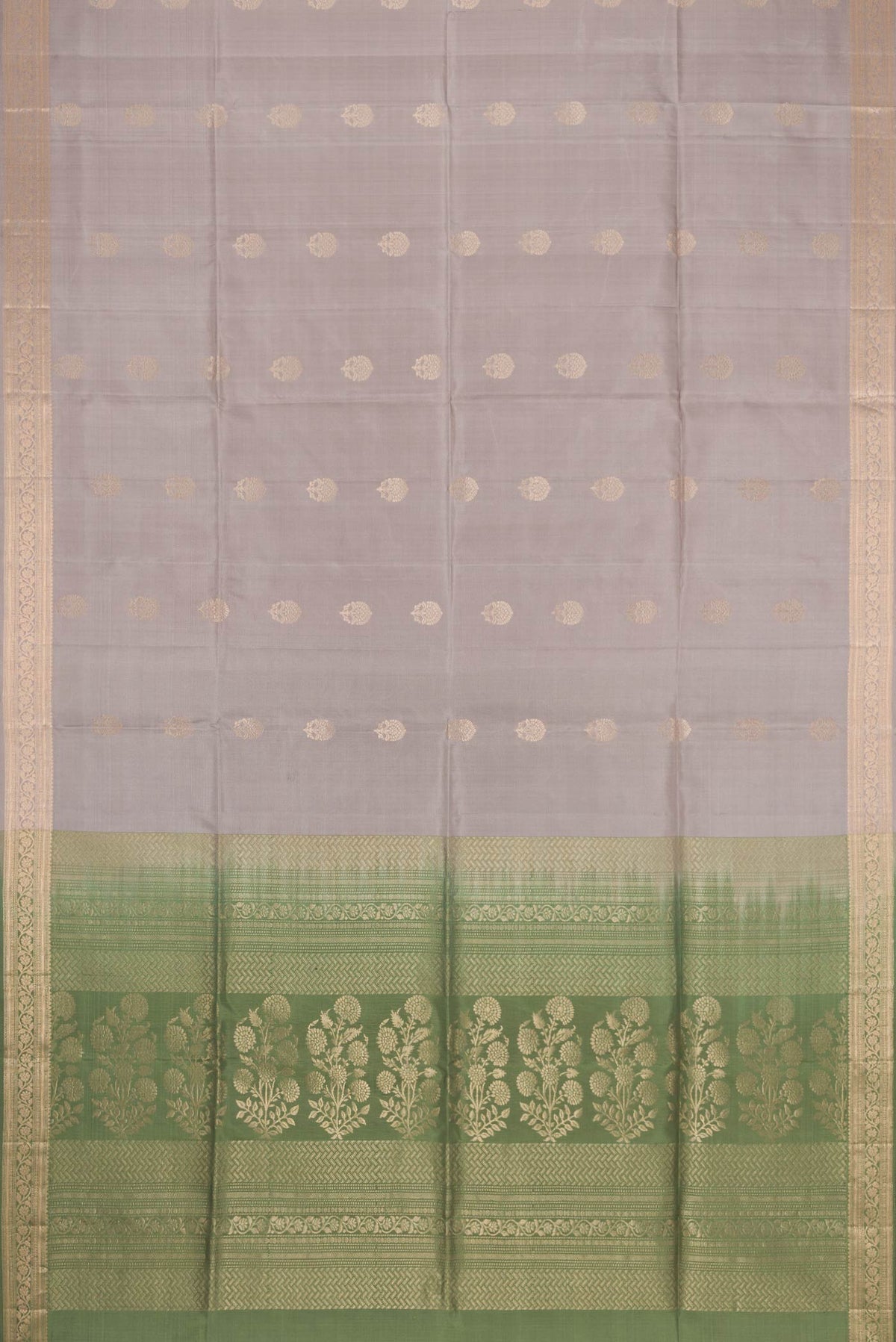 Flat view of Grey Dual Tone Soft Silk Saree with Zari Butta on the body and Zari Border. 