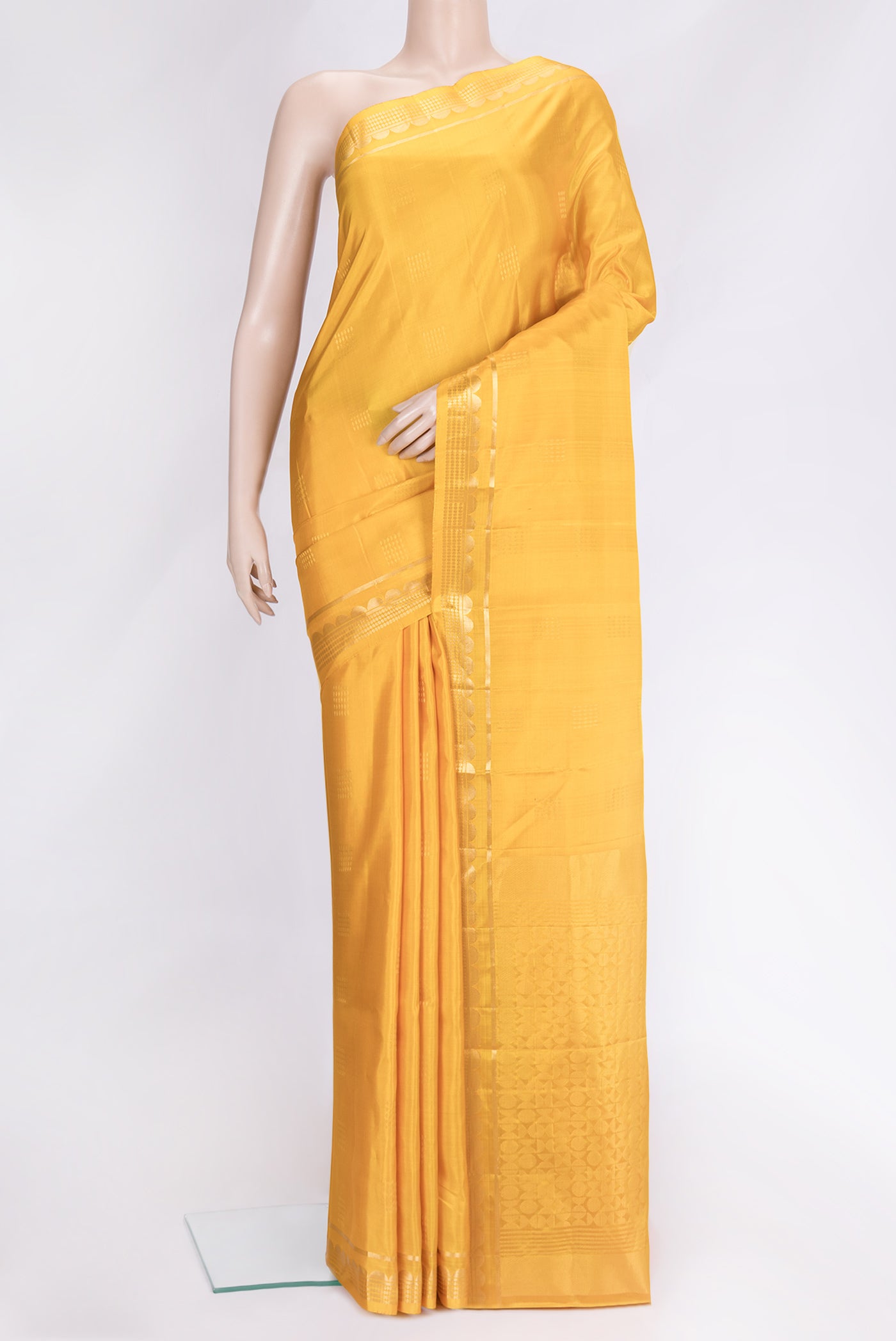 Yellow Dual Tone Soft Silk Saree with Zari Butta on the body and Zari Border.  displayed on a mannequin