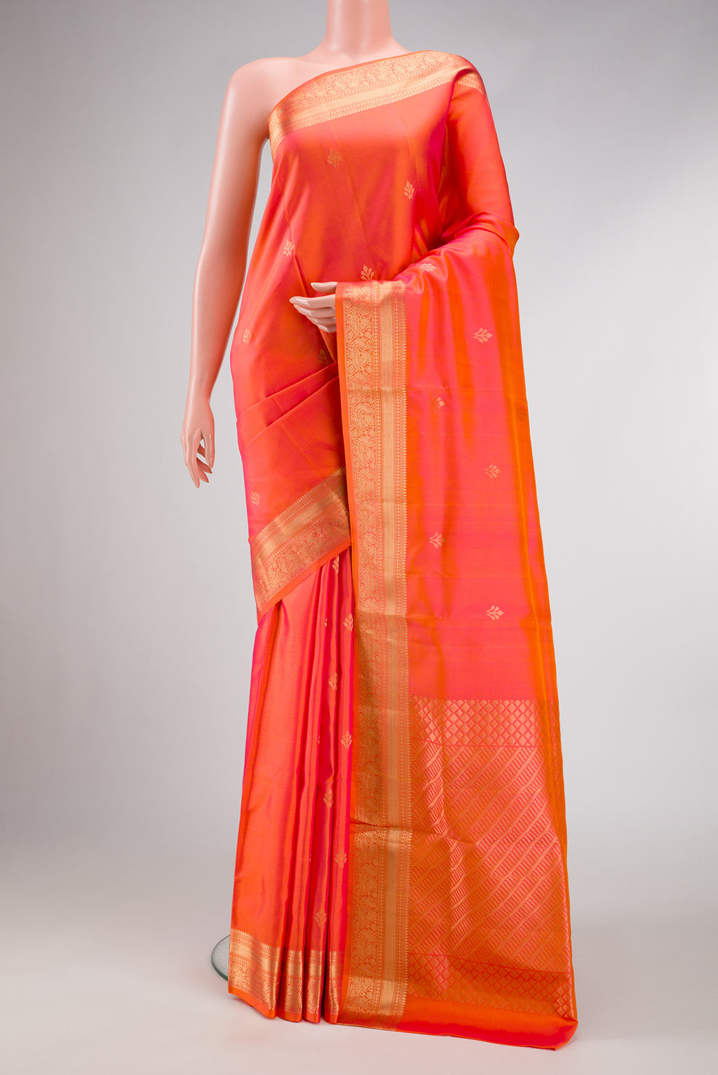 Orange Dual Tone Soft Silk Saree with Zari Butta on the body and Zari Border.  displayed on a mannequin