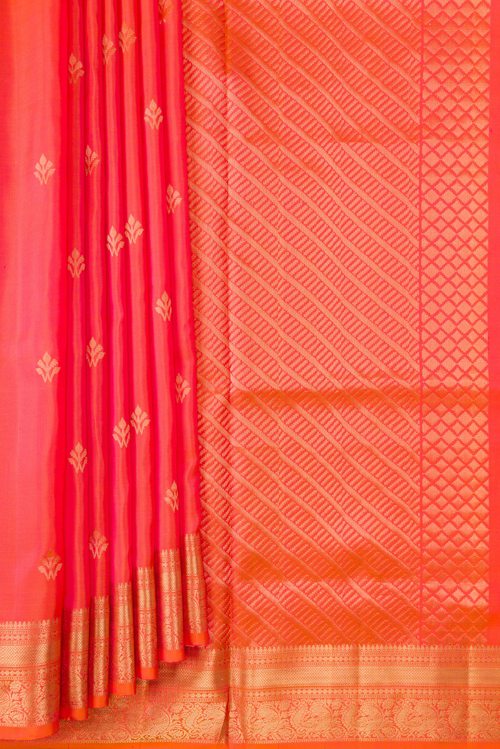 Pleats and pallu of Orange Dual Tone Soft Silk Saree with Zari Butta on the body and Zari Border. 