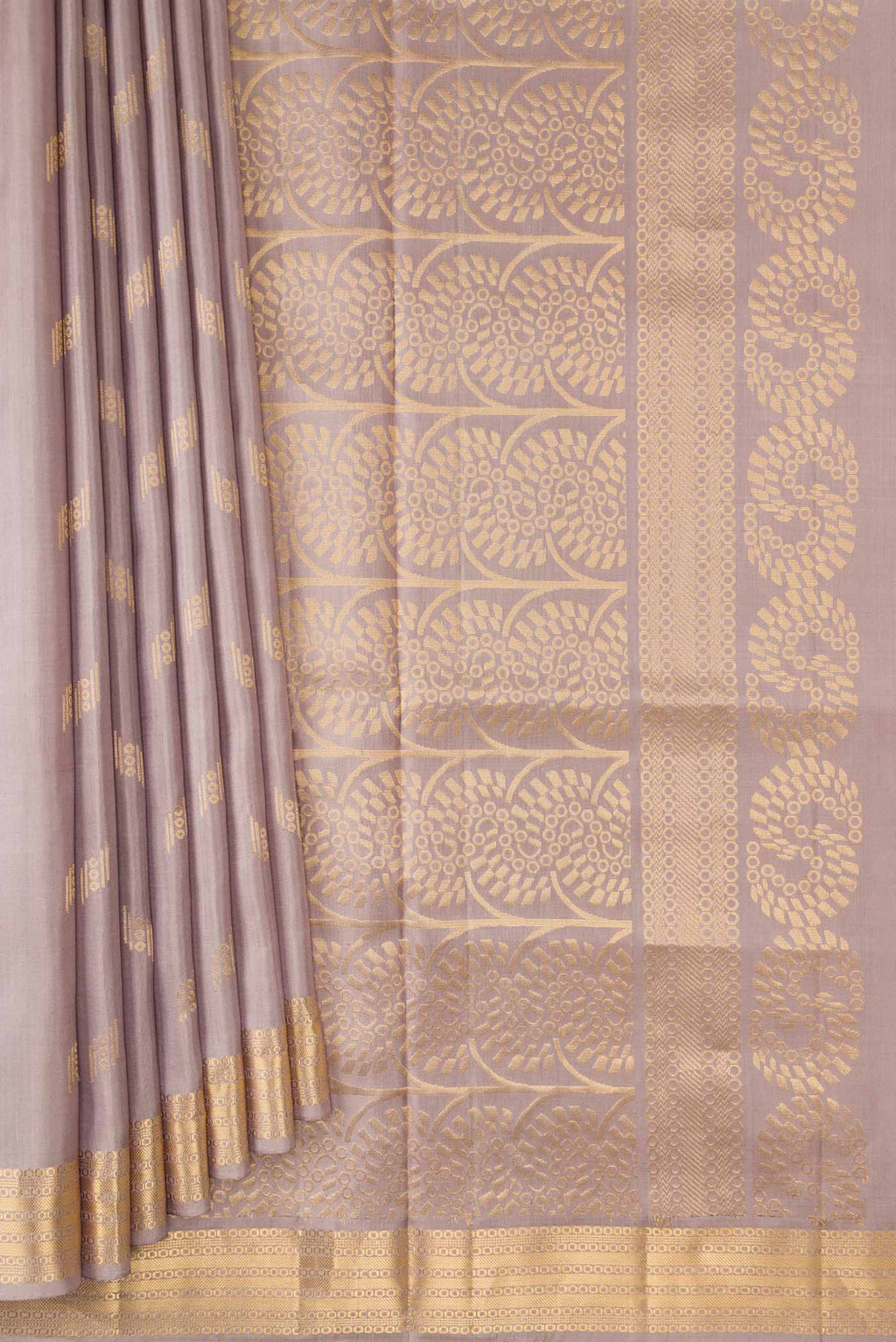 Pleats and pallu of Grey Dual Tone Soft Silk Saree with Zari Butta on the body and Zari Border. 
