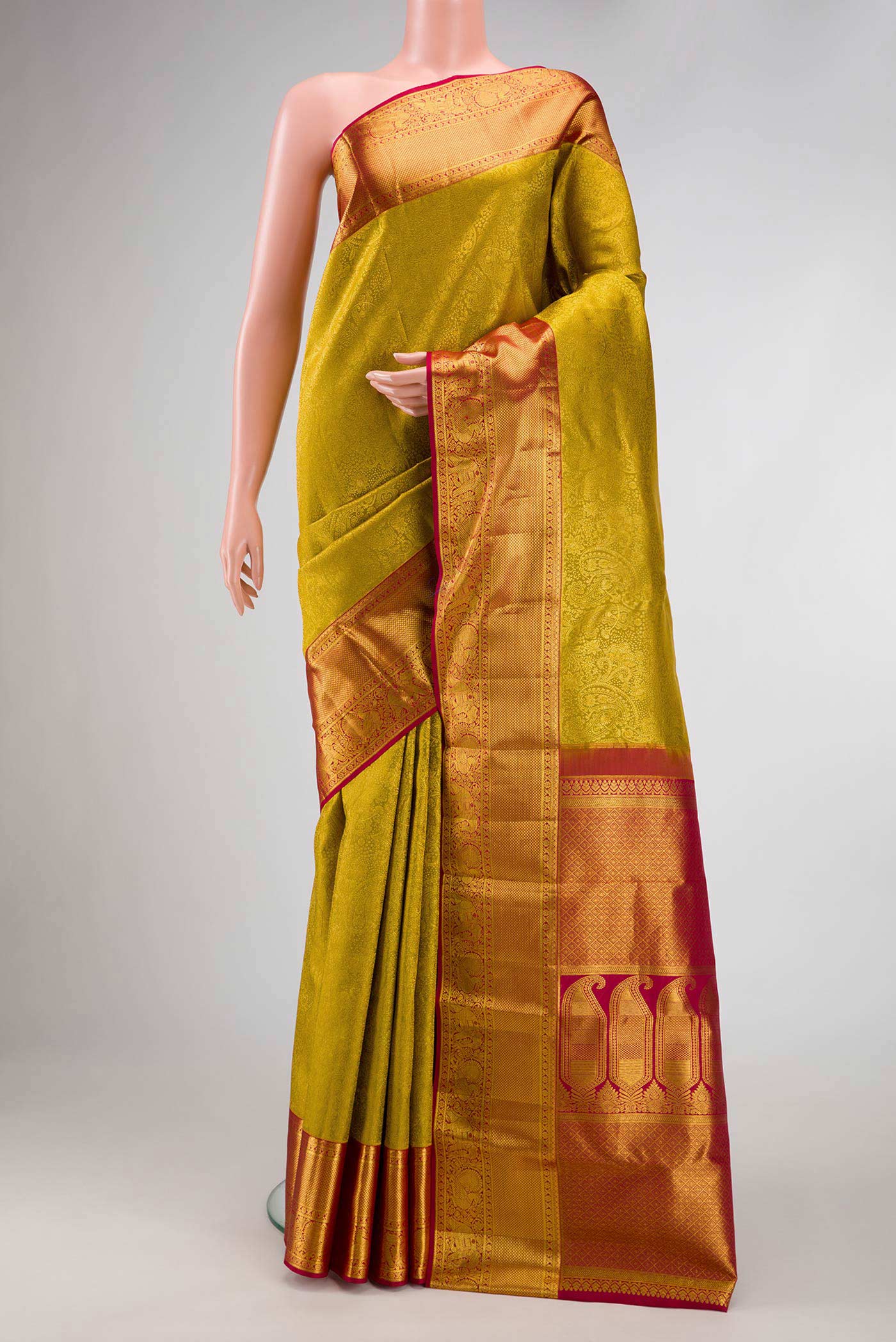 Mehandi Green Dual Tone Kanchipuram Silk Saree with Zari Brocade on the body and Zari Border.  displayed on a mannequin