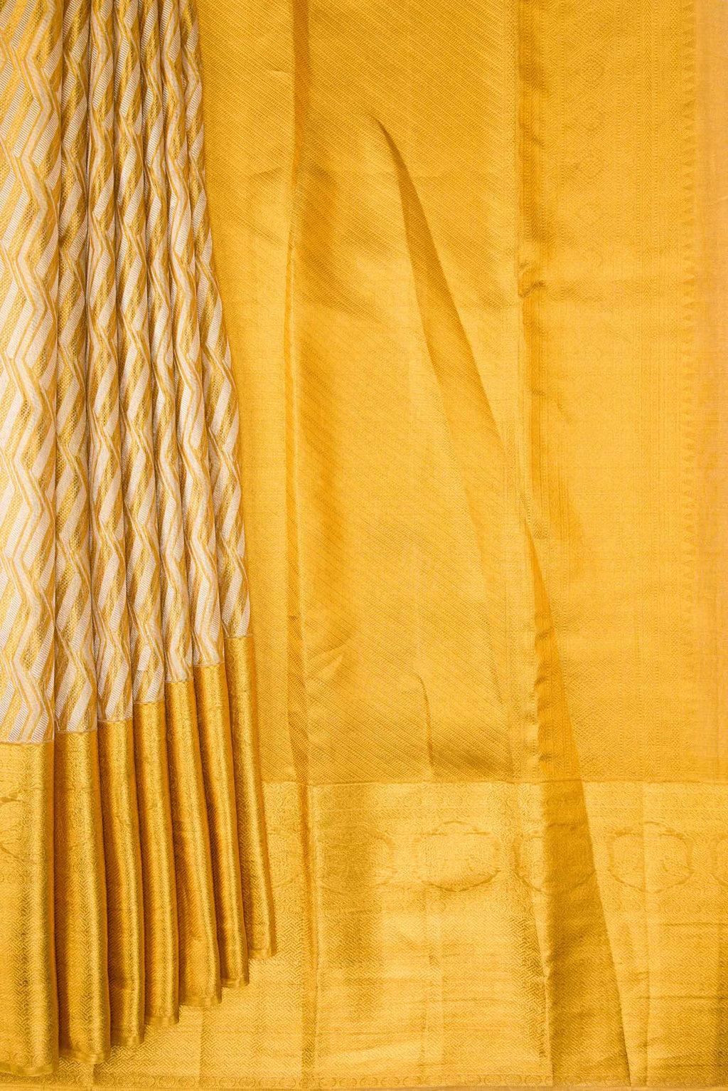 Pleats and pallu of Gold Dual Tone Kanjivaram Tissue Silk Saree with Zari Brocade on the body and Zari Border. 