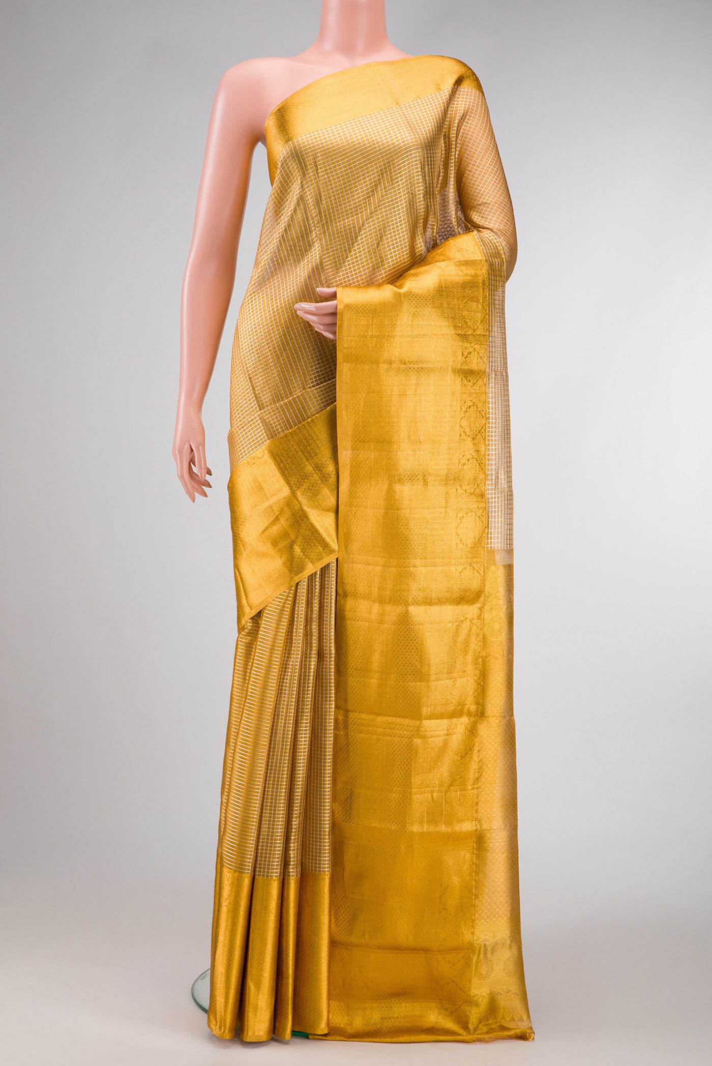 Gold Dual Tone Kanjivaram Tissue Silk Saree with Zari Brocade on the body and Zari Border.  displayed on a mannequin