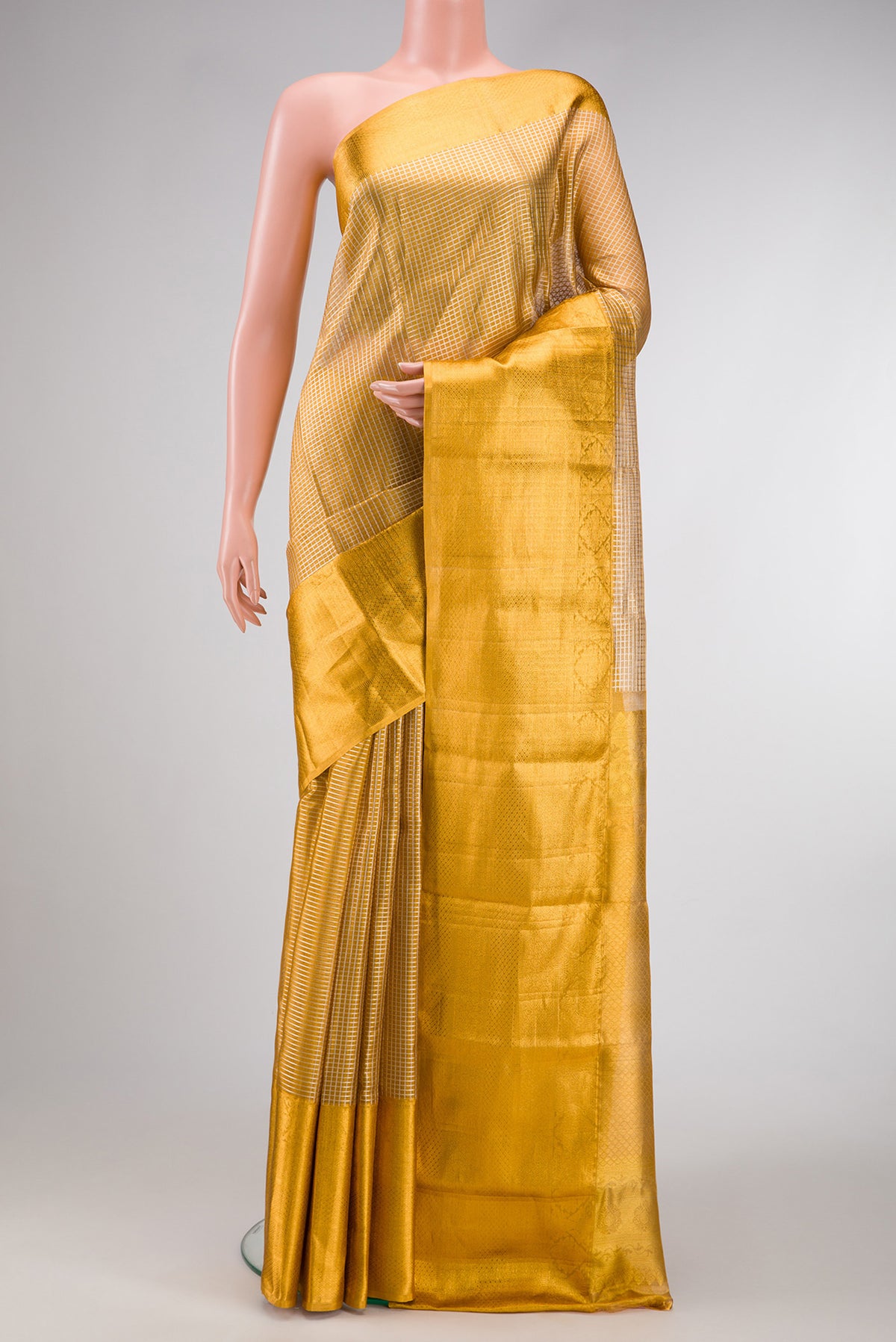 Gold Dual Tone Kanjivaram Tissue Silk Saree with Zari Brocade on the body and Zari Border.  displayed on a mannequin