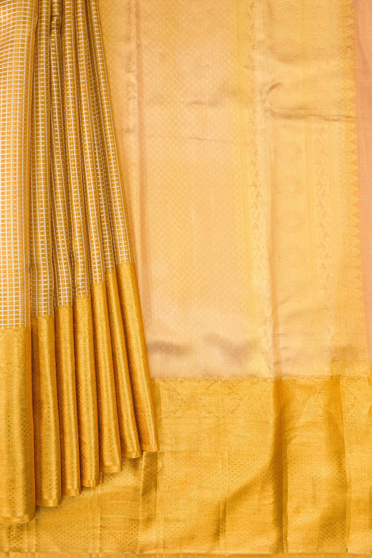 Pleats and pallu of Gold Dual Tone Kanjivaram Tissue Silk Saree with Zari Brocade on the body and Zari Border. 