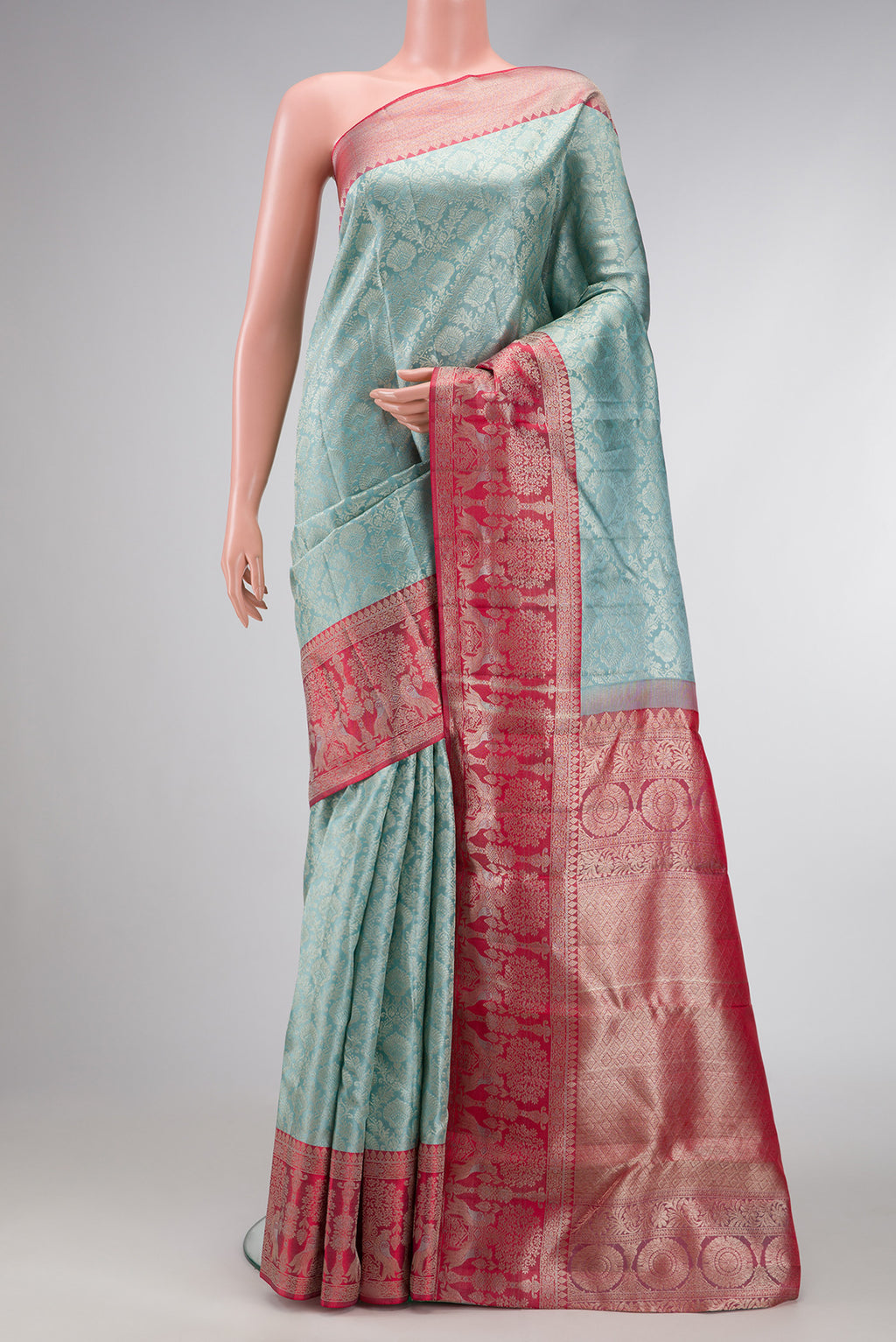 Maya Blue Dual Tone Kanjivaram Silk Saree with Zari Brocade on the body and Fancy Border.  displayed on a mannequin