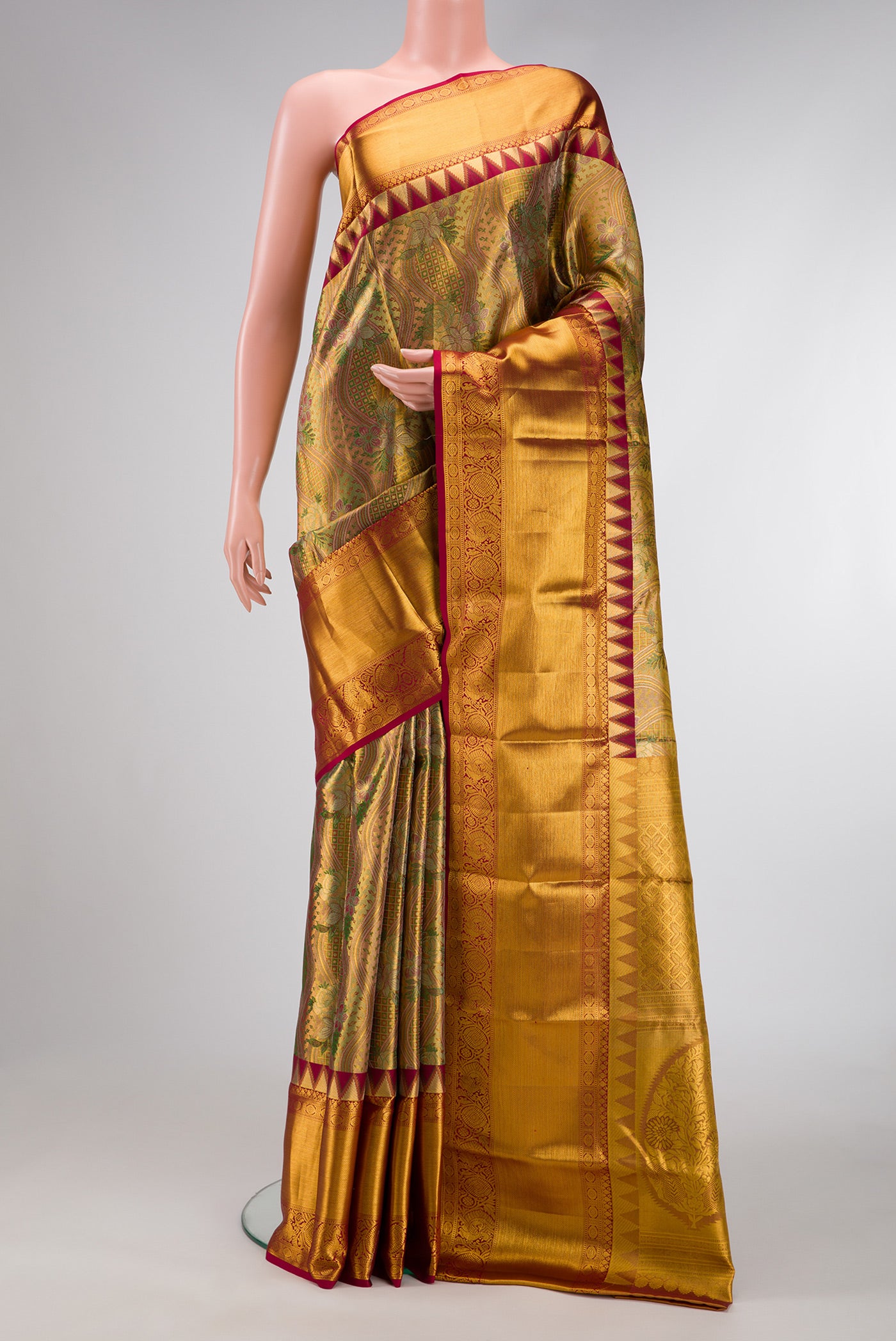 Gold Dual Tone Kanjivaram Tissue Silk Saree with Zari Brocade on the body and Zari Border.  displayed on a mannequin