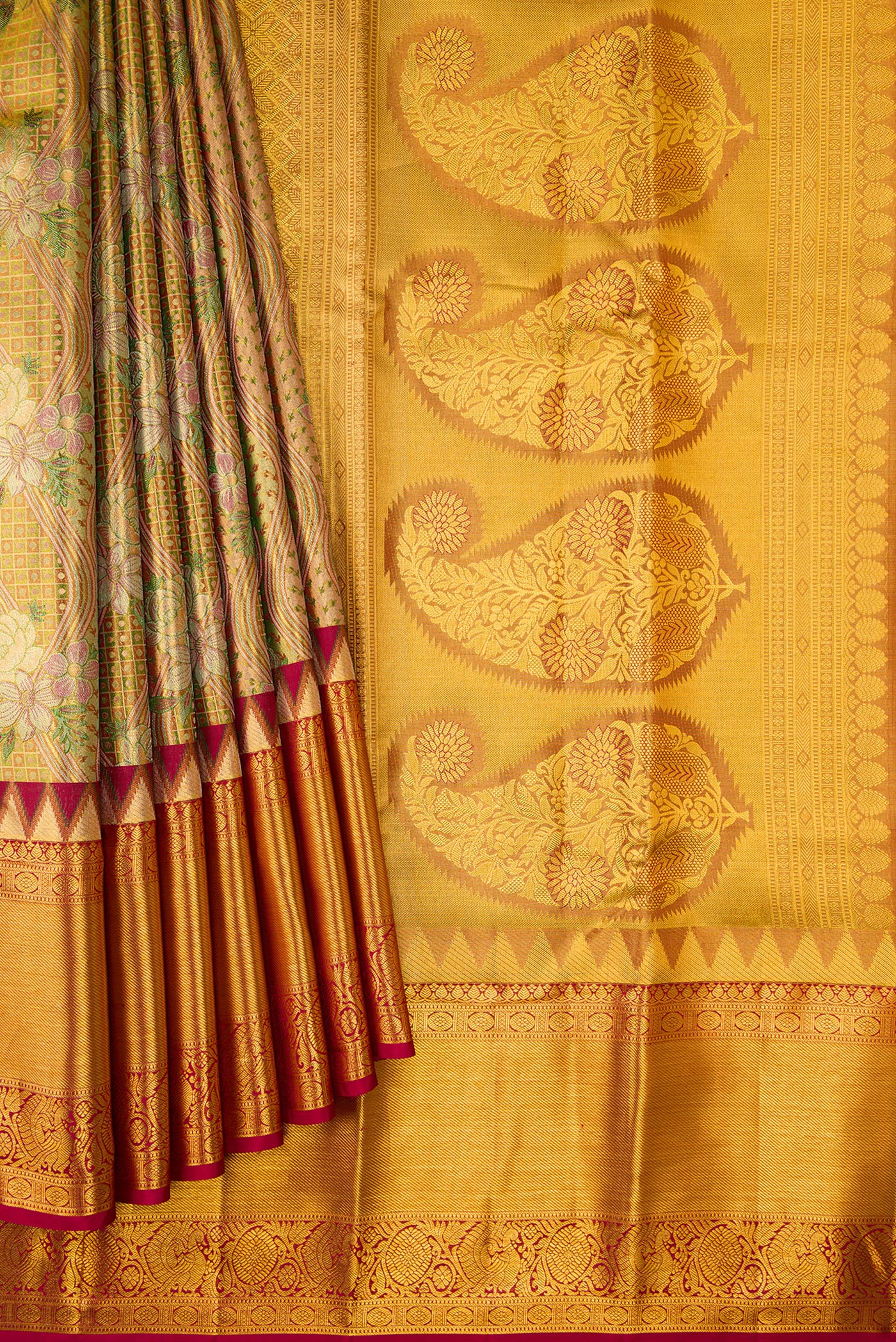 Pleats and pallu of Gold Dual Tone Kanjivaram Tissue Silk Saree with Zari Brocade on the body and Zari Border. 