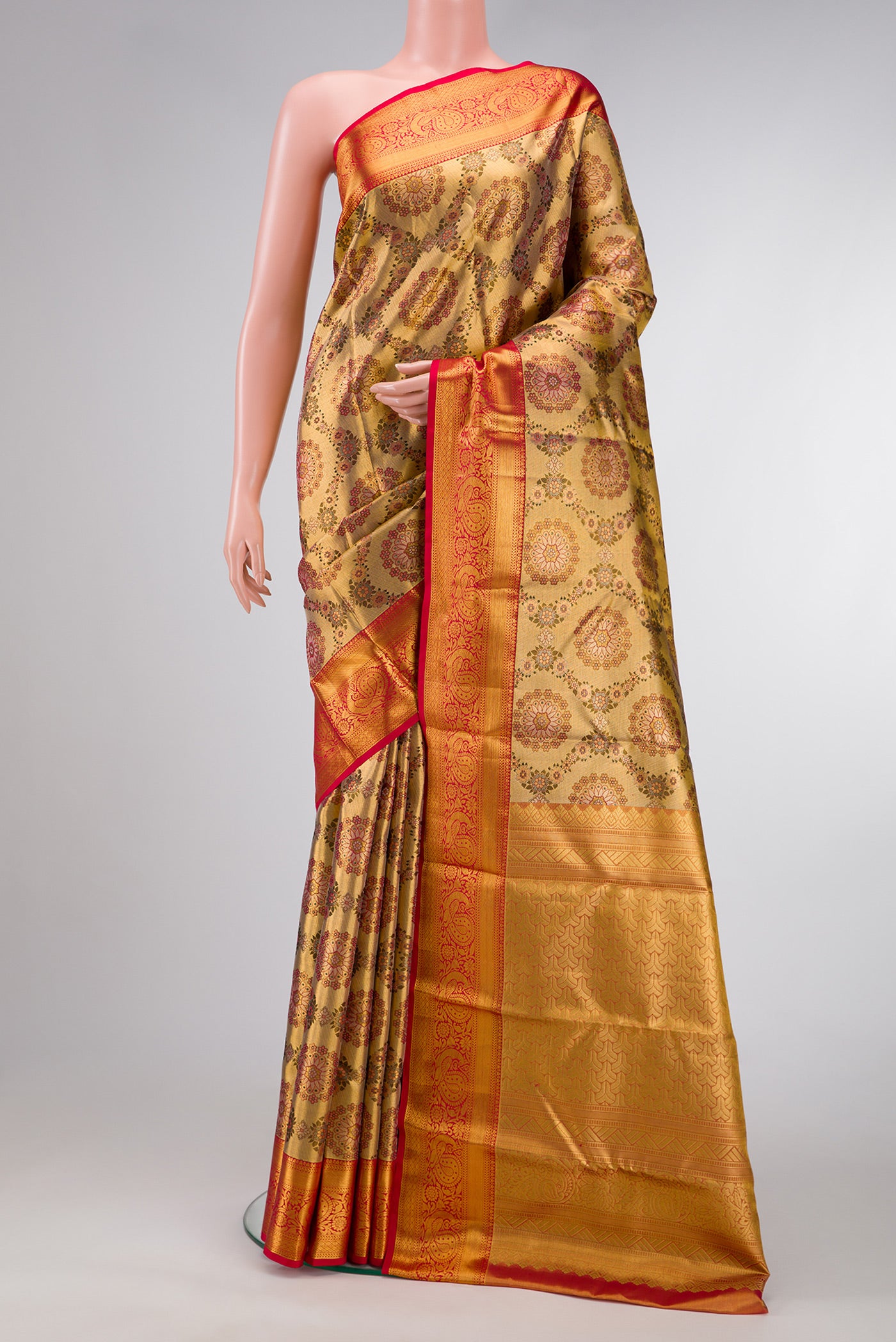 Gold Dual Tone Kanjivaram Tissue Silk Saree with Zari Brocade on the body and Zari Border.  displayed on a mannequin