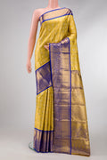 Gold Dual Tone Kanjivaram Tissue Silk Saree with Zari Brocade on the body and Zari Border.  displayed on a mannequin