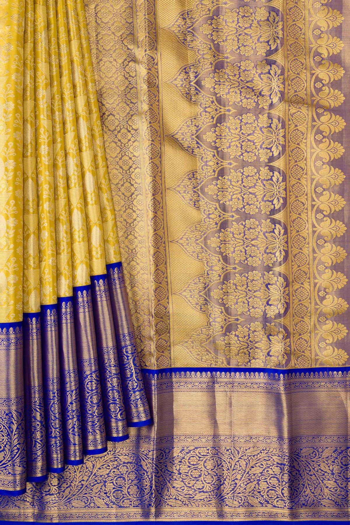 Pleats and pallu of Gold Dual Tone Kanjivaram Tissue Silk Saree with Zari Brocade on the body and Zari Border. 