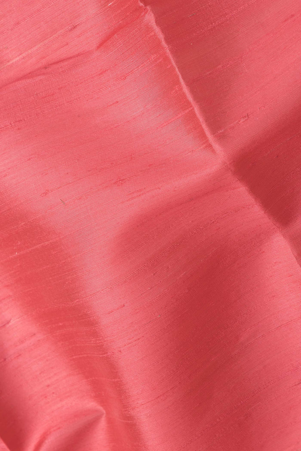 Close up of Pink Dual Tone Raw Silk Saree with Plain Body and Zari Border.  displaying folds