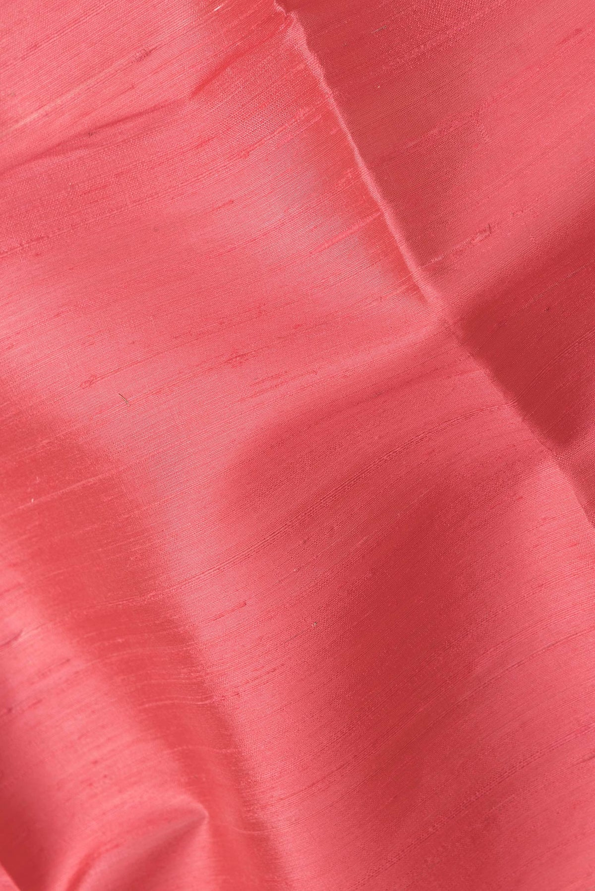 Close up of Pink Dual Tone Raw Silk Saree with Plain Body and Zari Border.  displaying folds