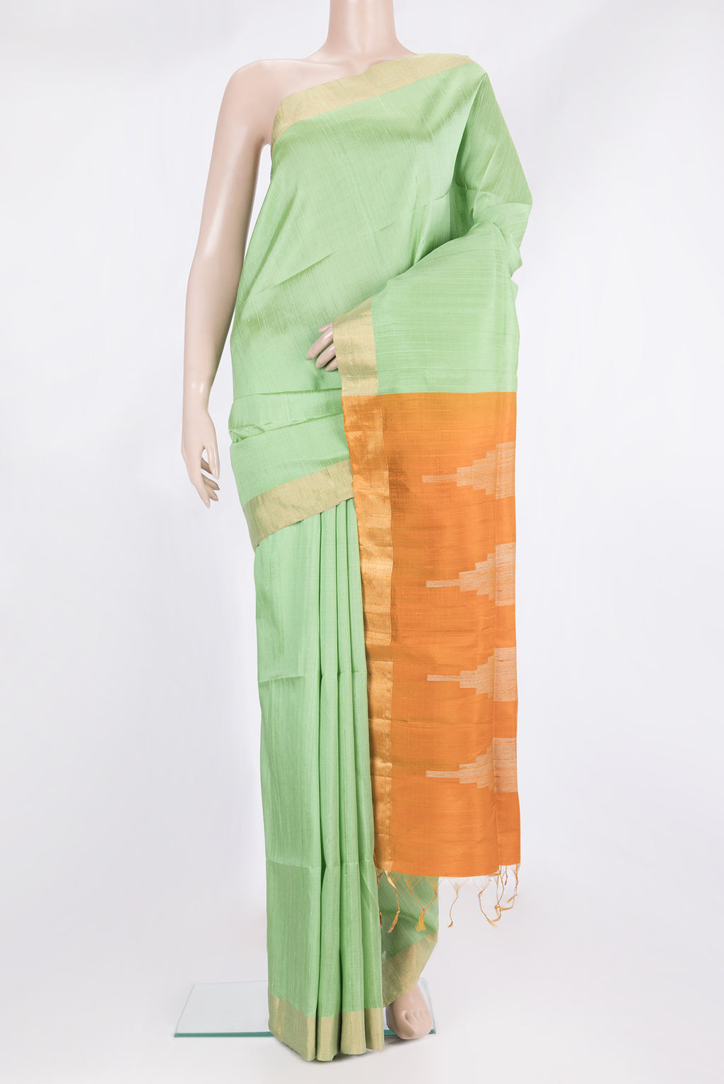 Pure Silk Pista Green Raw Saree with Plain Body and Zari Border.  displayed on a mannequin