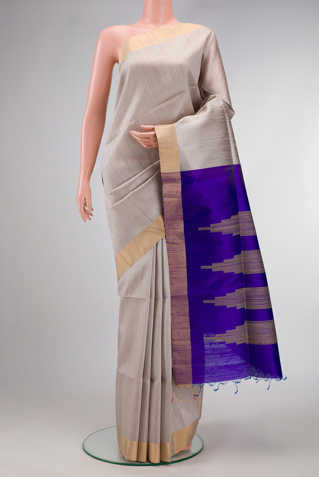 Grey Dual Tone Raw Silk Saree with Plain Body and Zari Border.  displayed on a mannequin