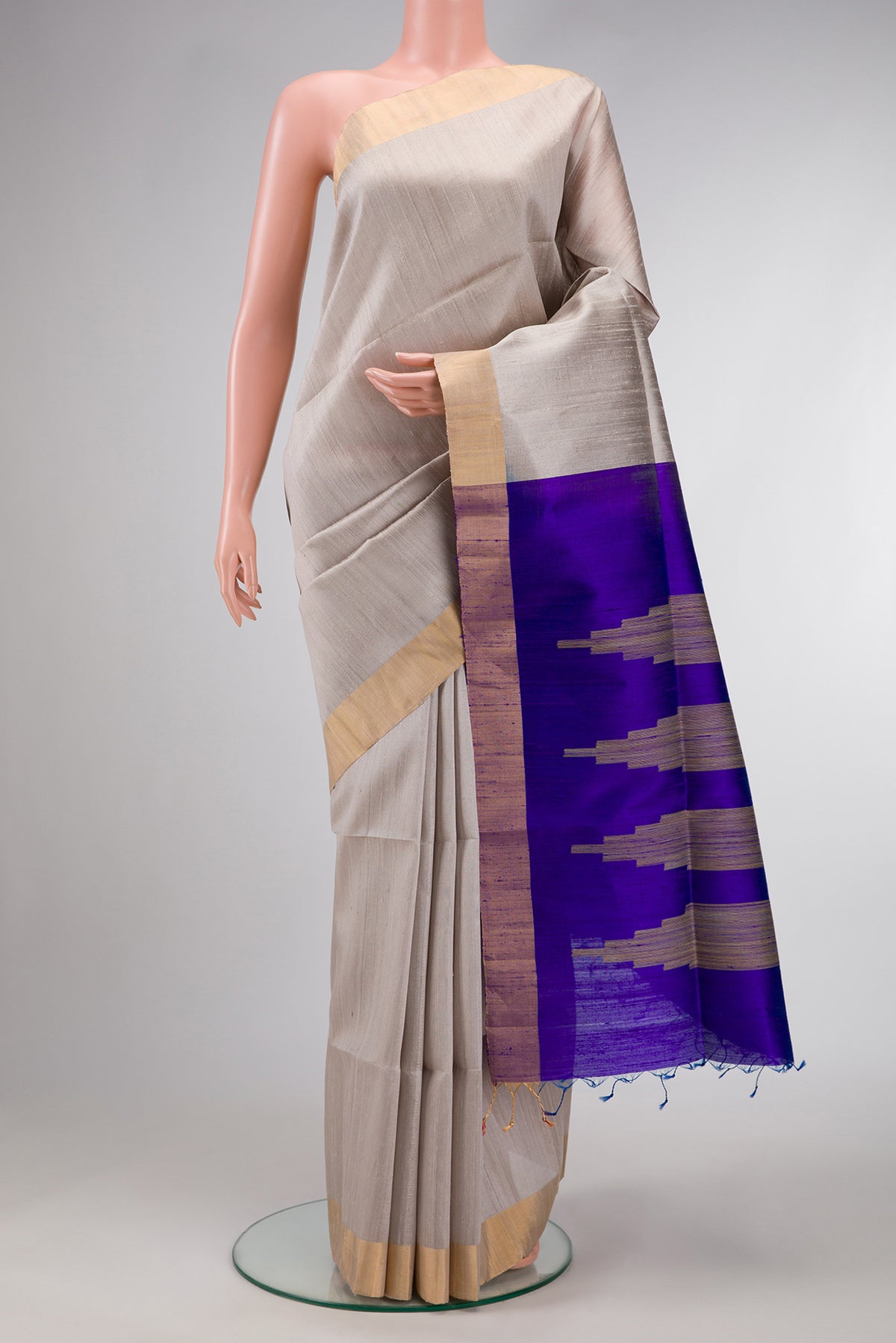 Grey Dual Tone Raw Silk Saree with Plain Body and Zari Border.  displayed on a mannequin