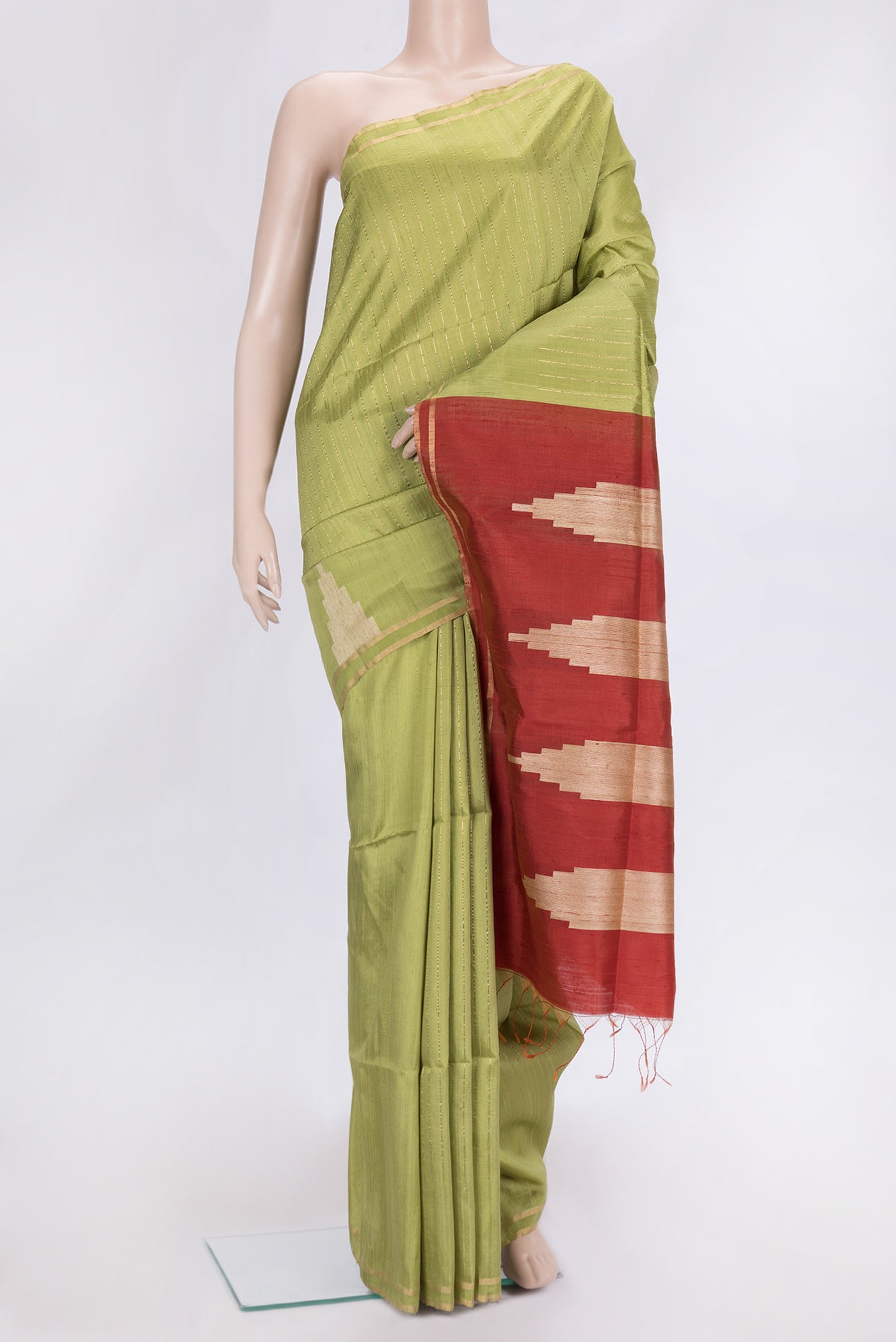 Pista Green Dual Tone Raw Silk Saree with Stripes on the body and Temple Border.  displayed on a mannequin