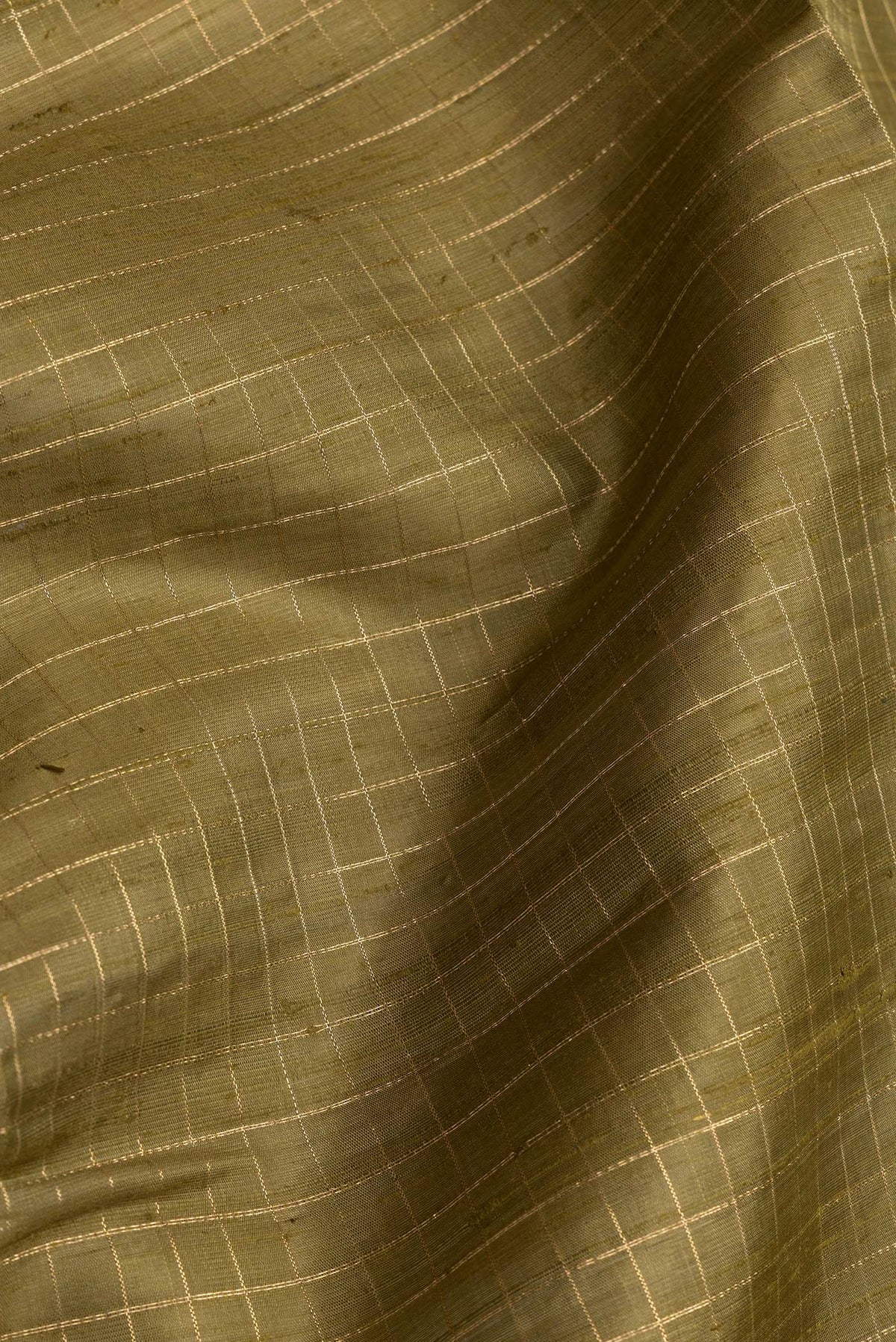 Close up of Mehandi Green Dual Tone Raw Silk Saree with Checked design on the body and Zari Border.  displaying folds