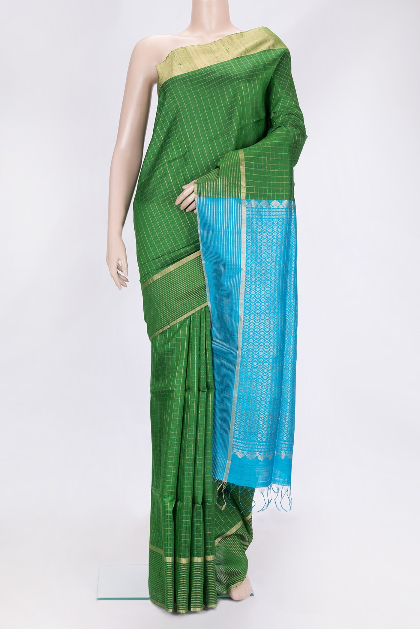 Green Dual Tone Raw Silk Saree with Checked design on the body and Zari Border.  displayed on a mannequin
