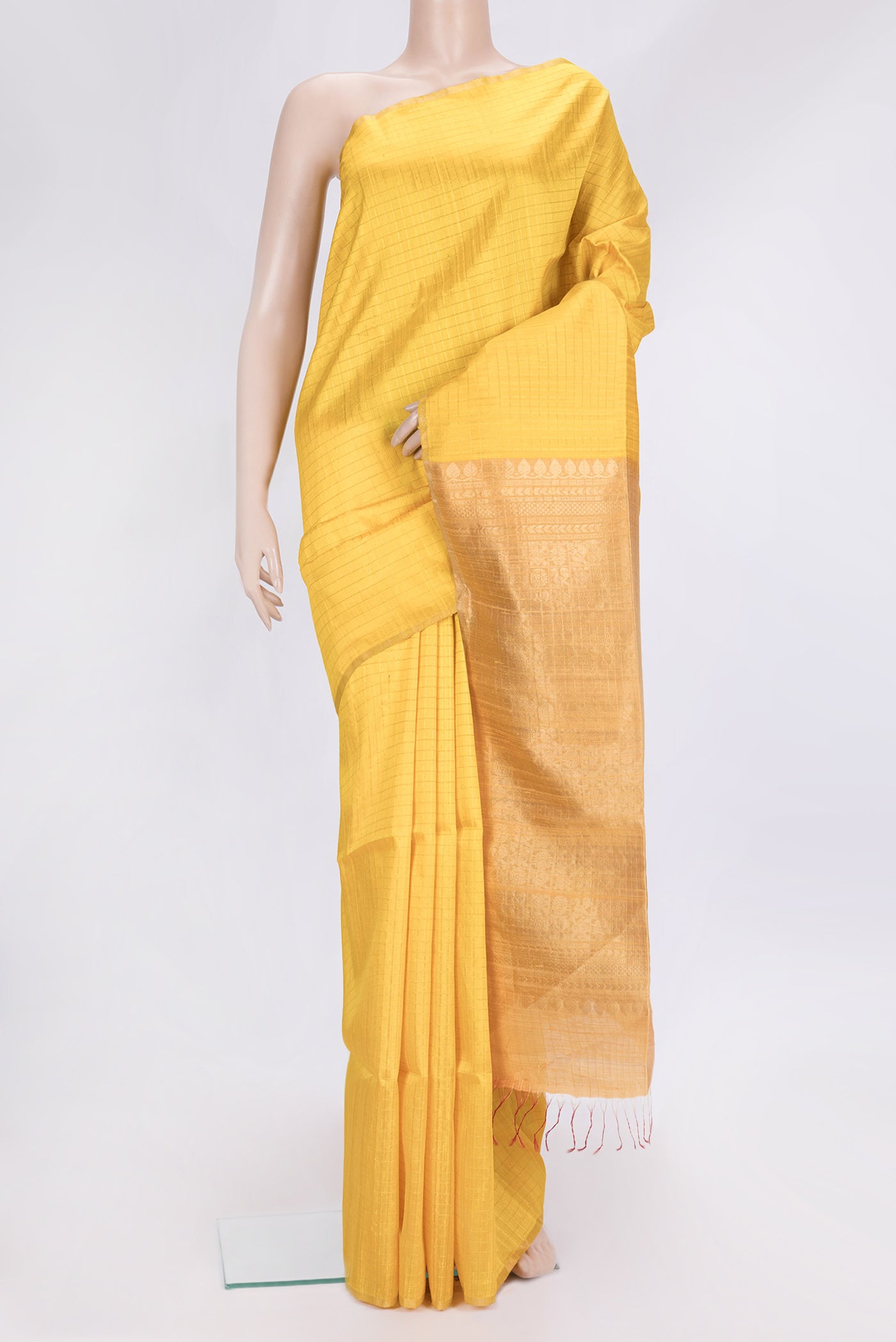 Yellow Dual Tone Raw Silk Saree with Checked design on the body and Zari Border.  displayed on a mannequin