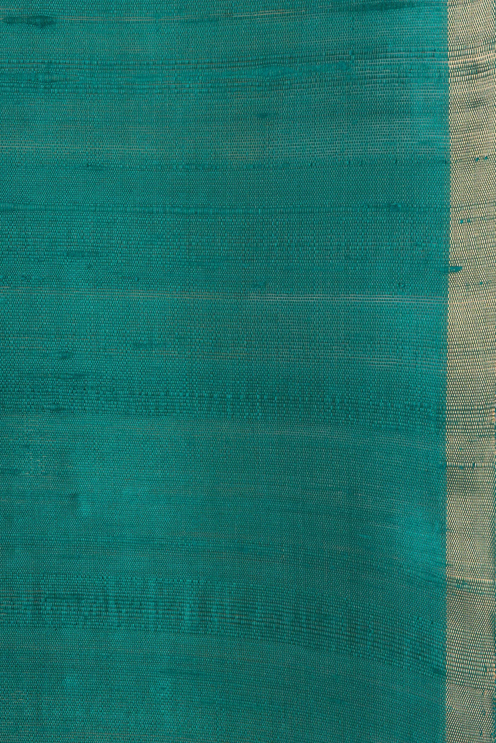 Border image of Peacock Blue Dual Tone Raw Silk Saree with Plain Body and Thin Zari Line. 