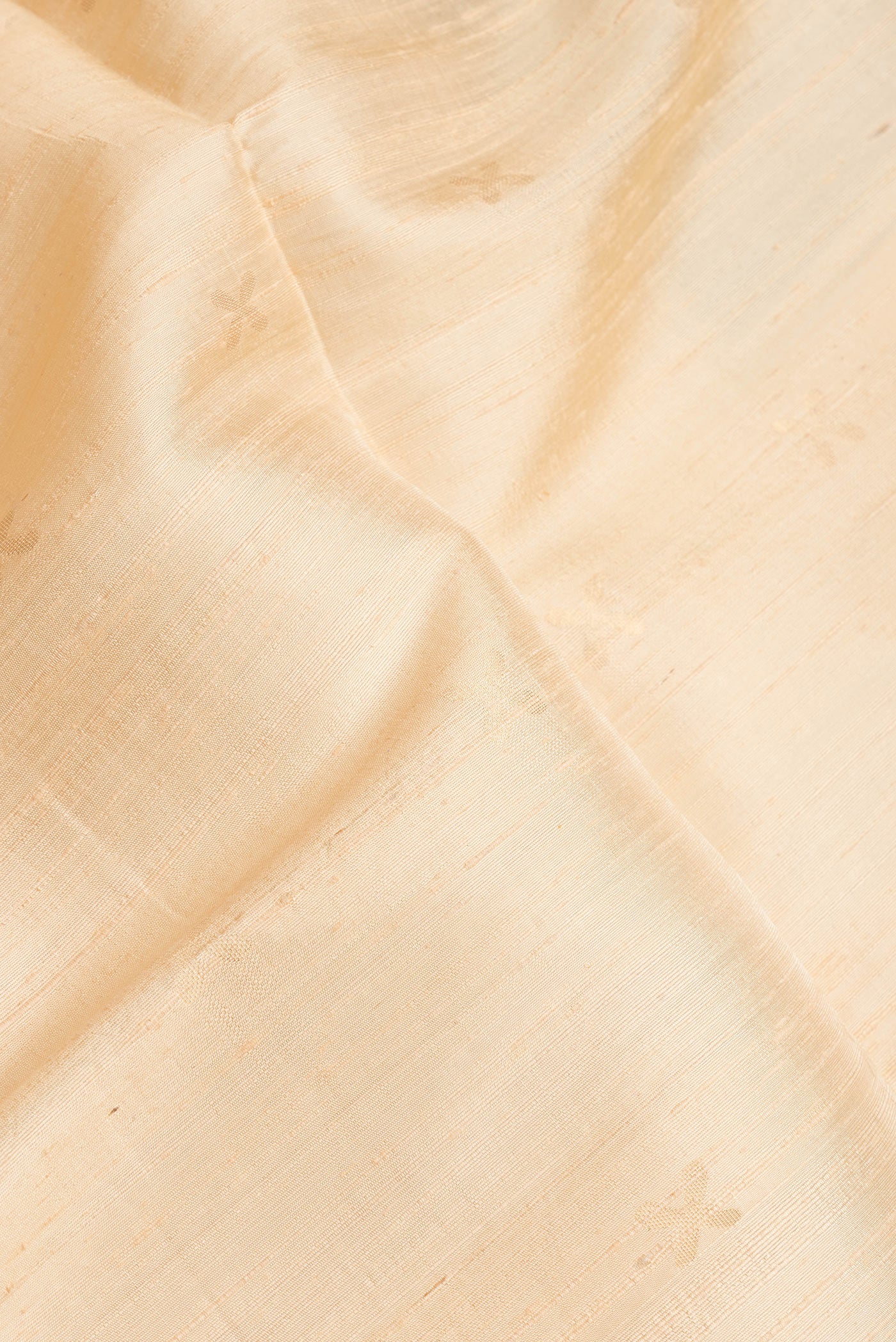 Close up of Sandal Dual Tone Raw Silk Saree with Zari Butta on the body and Thin Zari Line.  displaying folds
