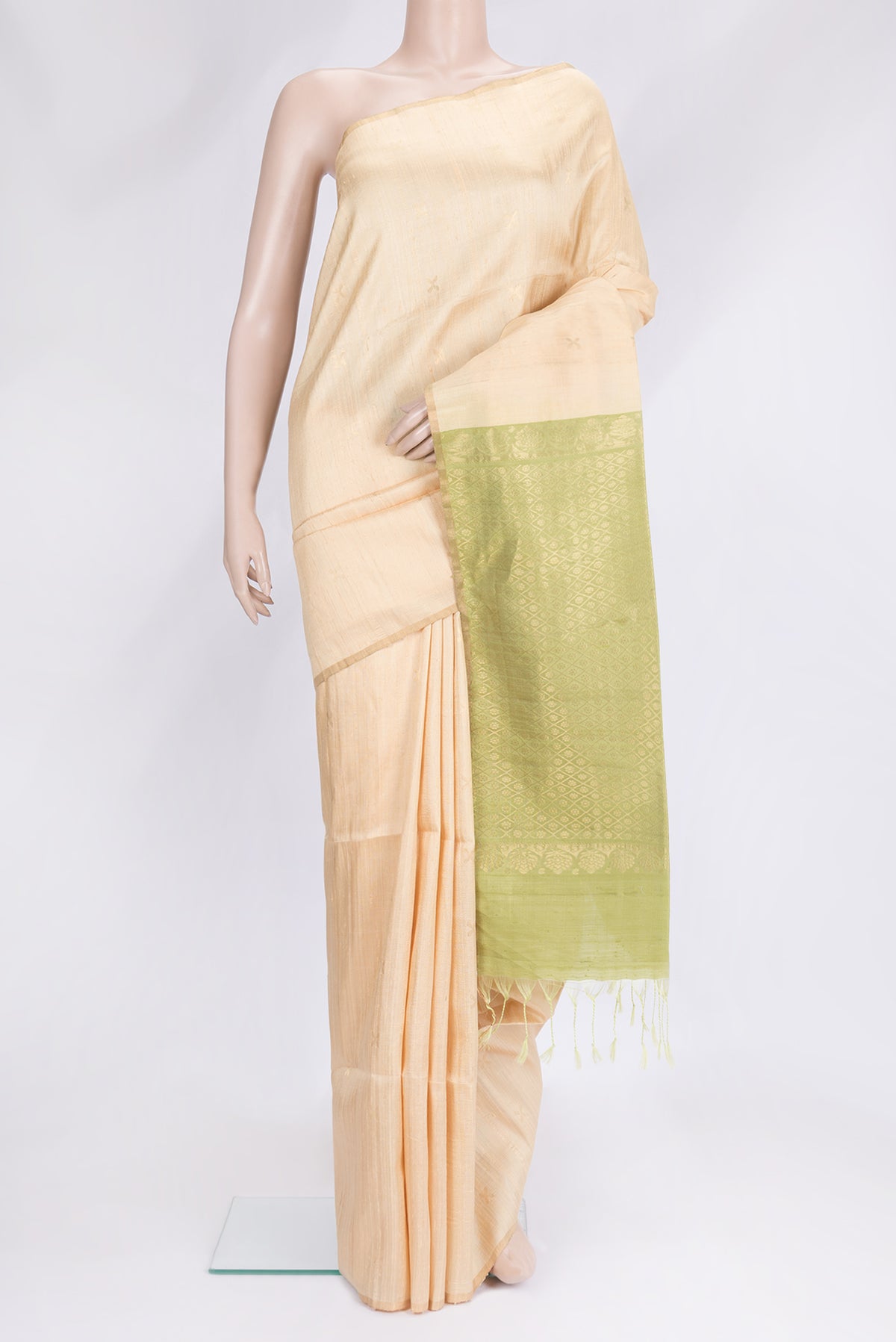 Sandal Dual Tone Raw Silk Saree with Zari Butta on the body and Thin Zari Line.  displayed on a mannequin