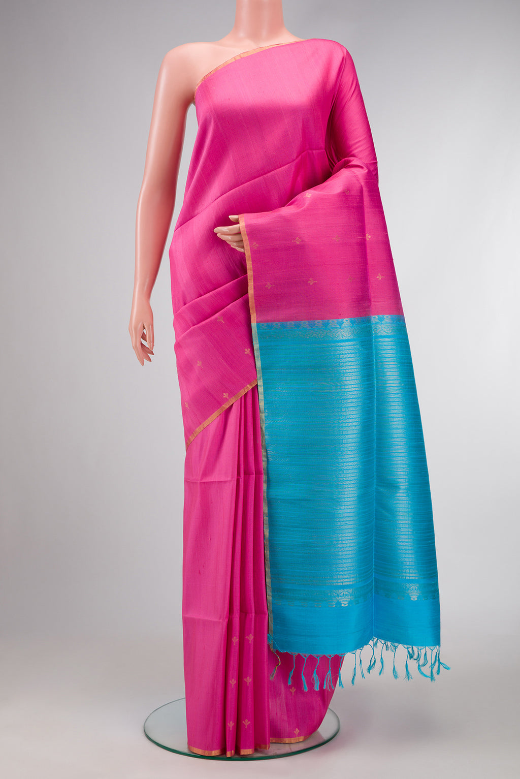Pink Dual Tone Raw Silk Saree with Zari Butta on the body and Zari Border.  displayed on a mannequin