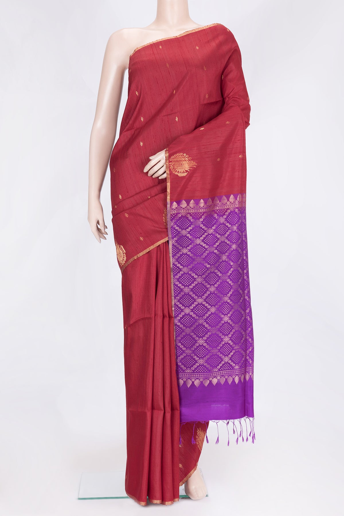 Maroon Dual Tone Raw Silk Saree with Zari Butta on the body and Fancy Border.  displayed on a mannequin