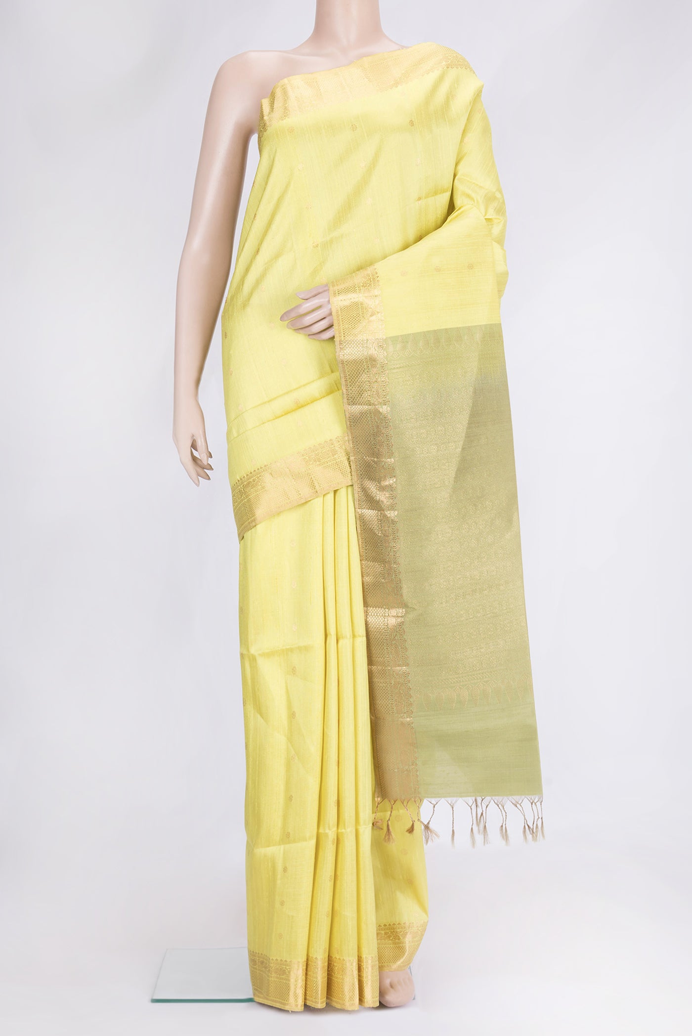 Lemon Yellow Dual Tone Raw Silk Saree with Zari Butta on the body and Zari Border.  displayed on a mannequin