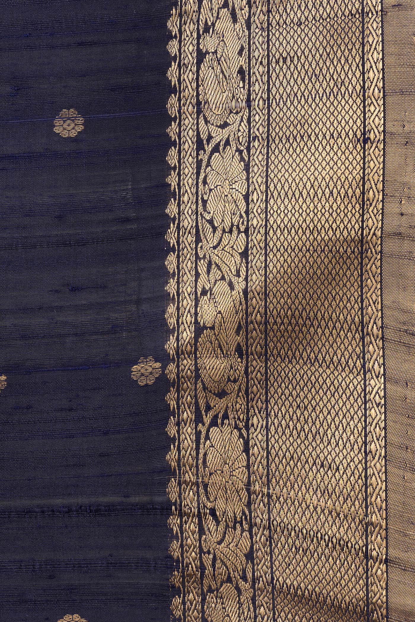 Border image of Navy Blue Dual Tone Raw Silk Saree with Zari Butta on the body and Zari Border. 