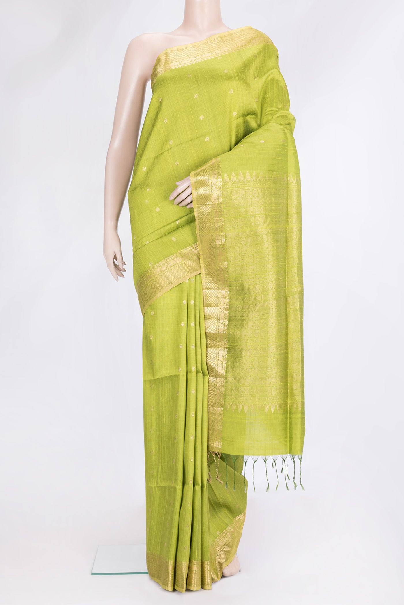Parrot Green Dual Tone Raw Silk Saree with Zari Butta on the body and Zari Border.  displayed on a mannequin