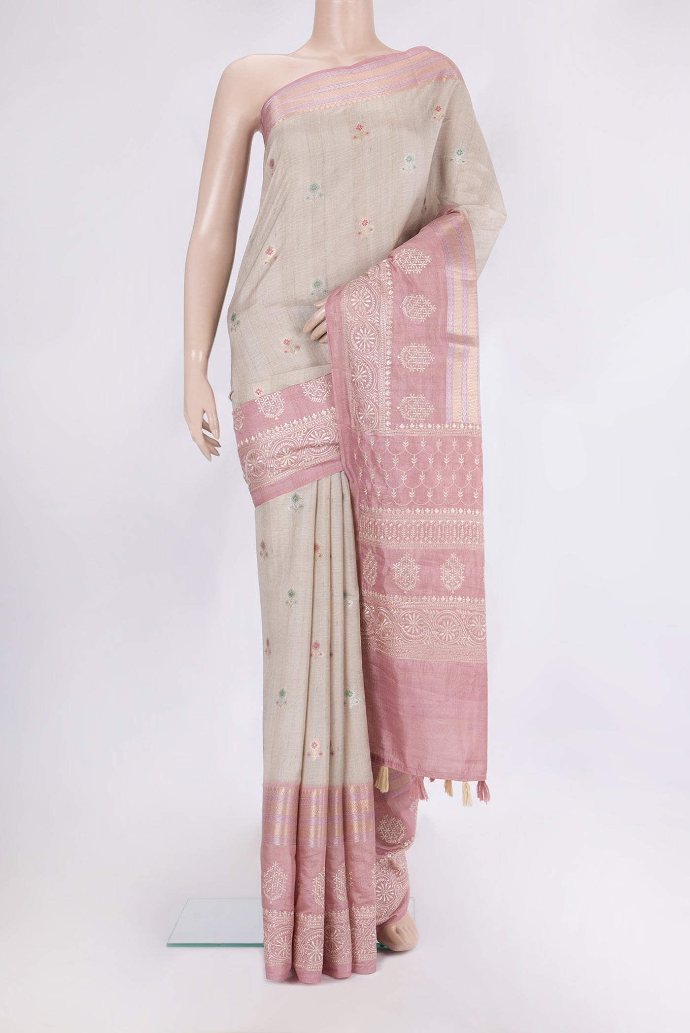 Beige Blended Tussar Silk Saree with Zari Butta on the body and Zari Border.  displayed on a mannequin